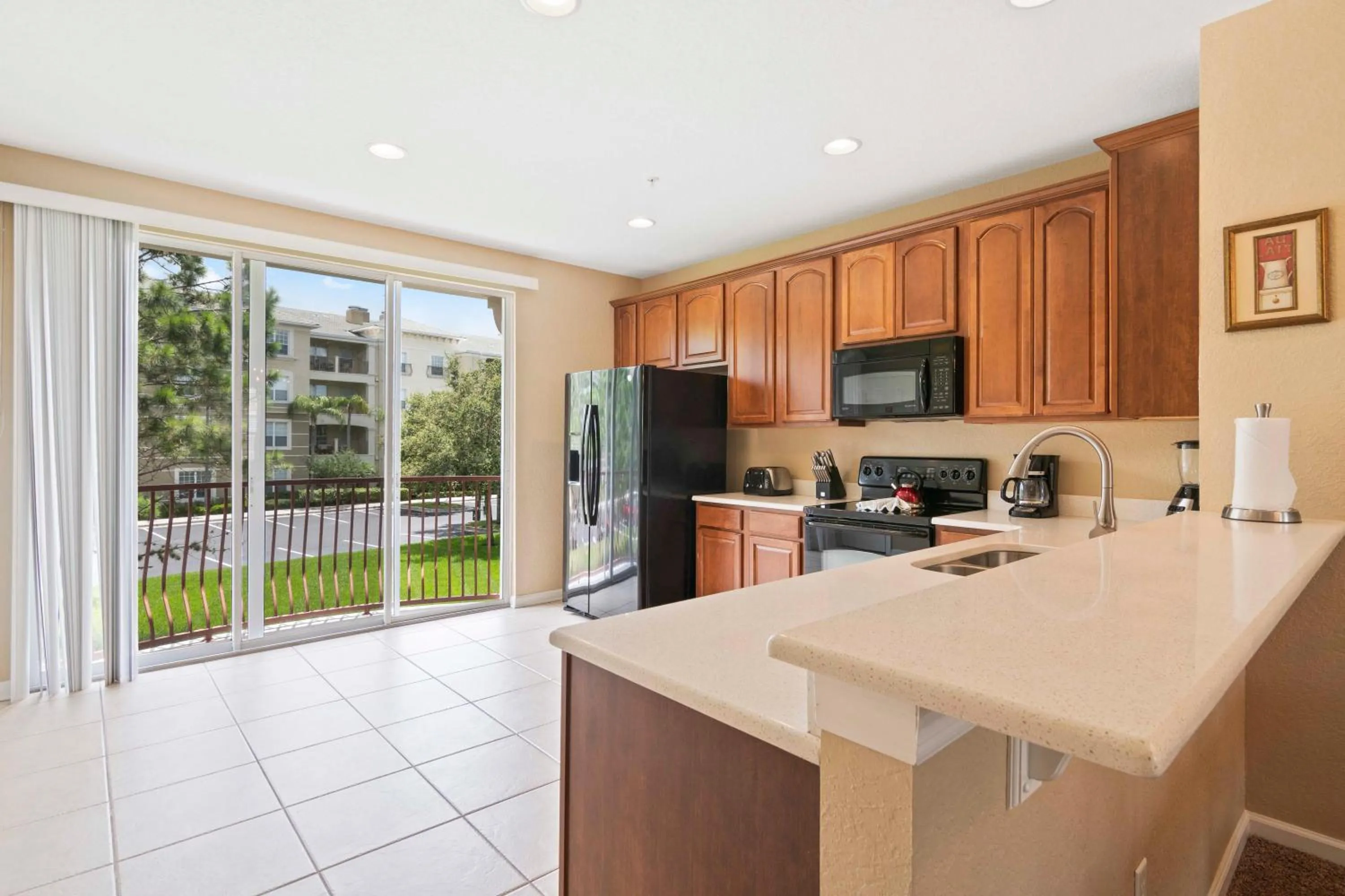 Kitchen or kitchenette in Orlando Resort Rentals at Universal Boulevard