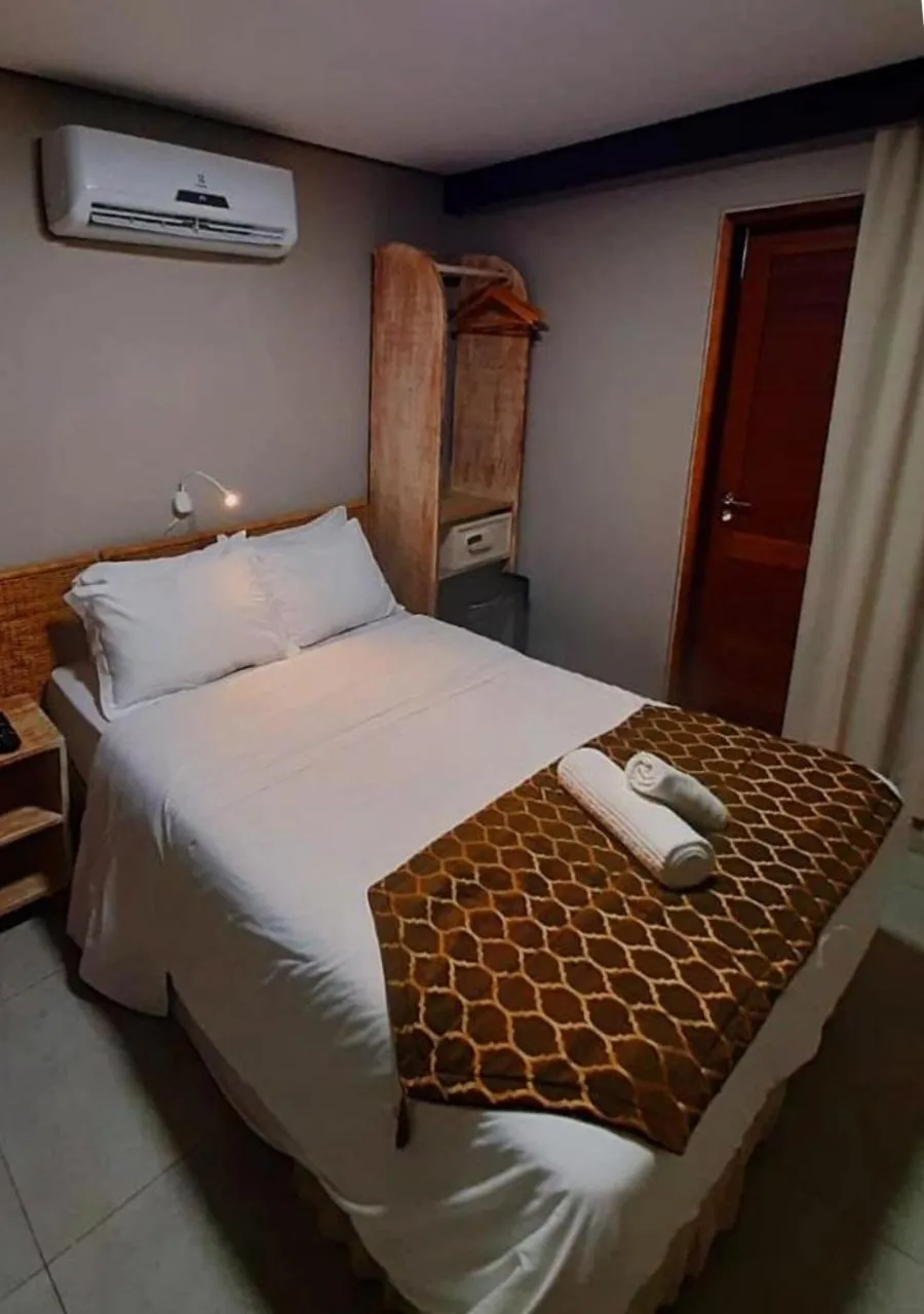 Bed in Pousada Recanto