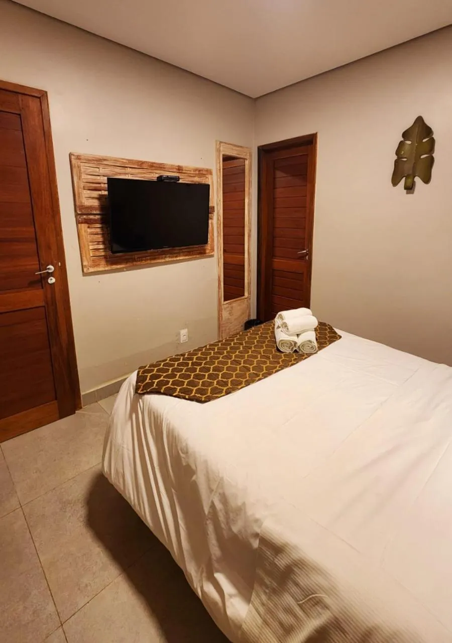 Bed in Pousada Recanto