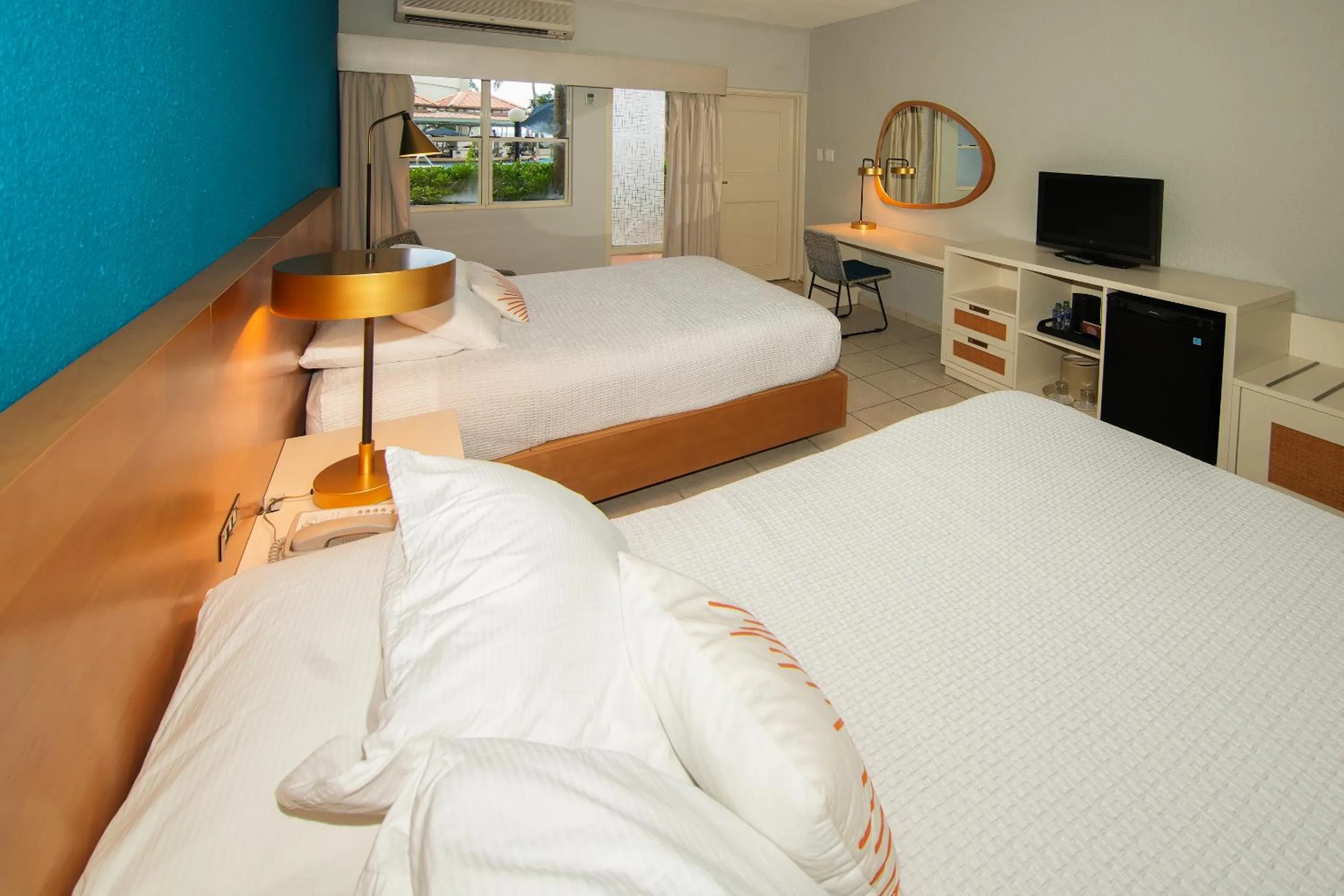 Bed in Rincon of the Seas Grand Caribbean Hotel