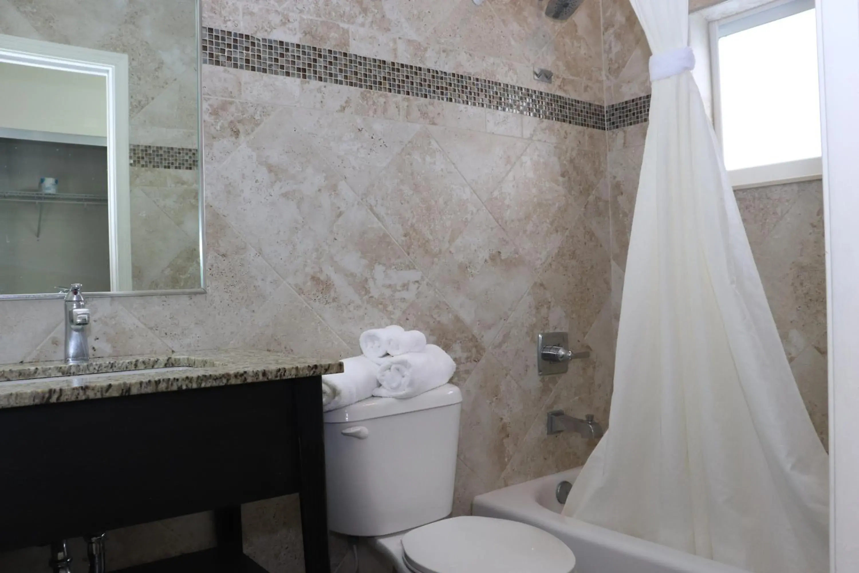 Shower, Bathroom in Curtis Inn & Suites