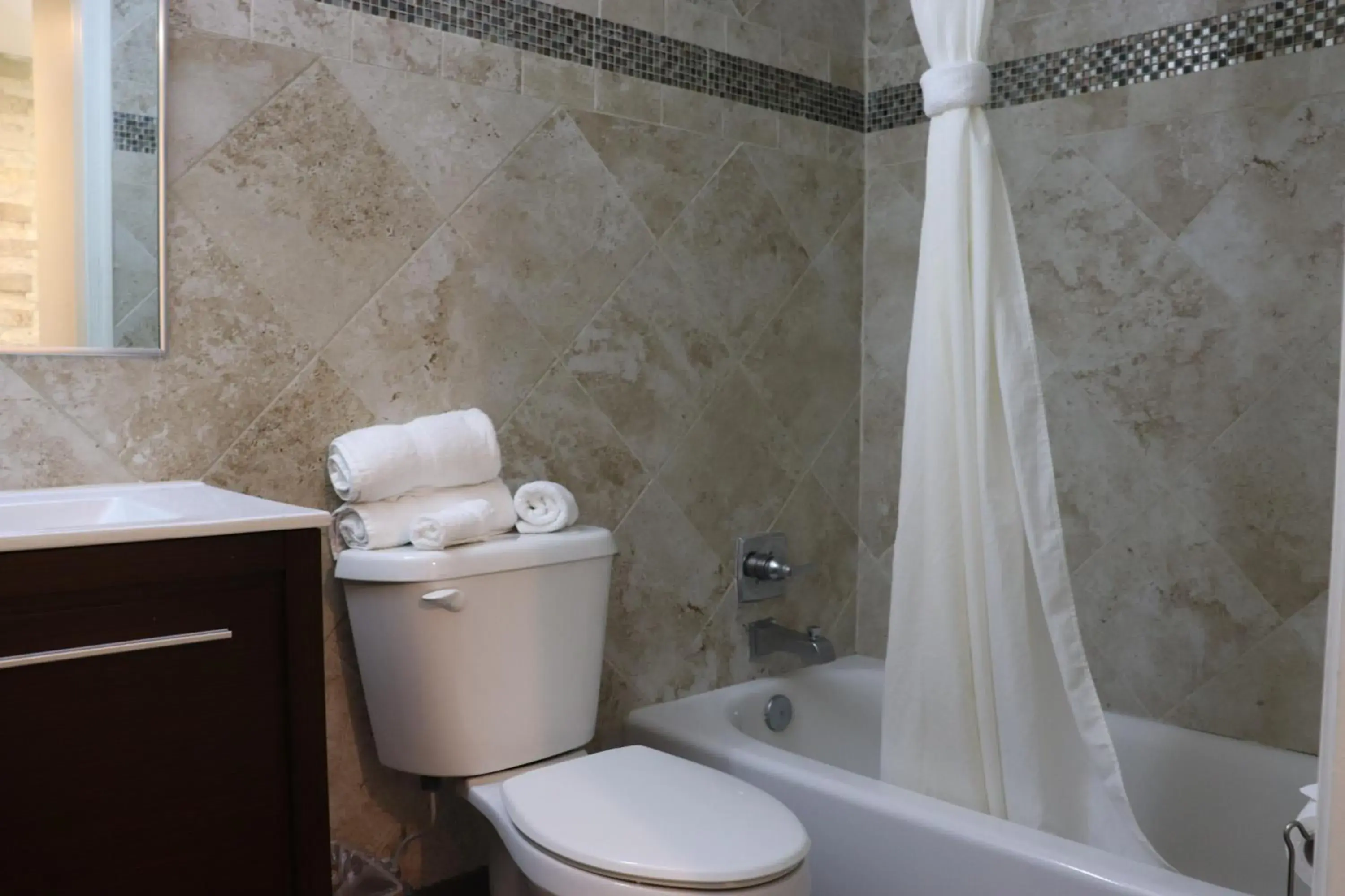 Shower, Bathroom in Curtis Inn & Suites