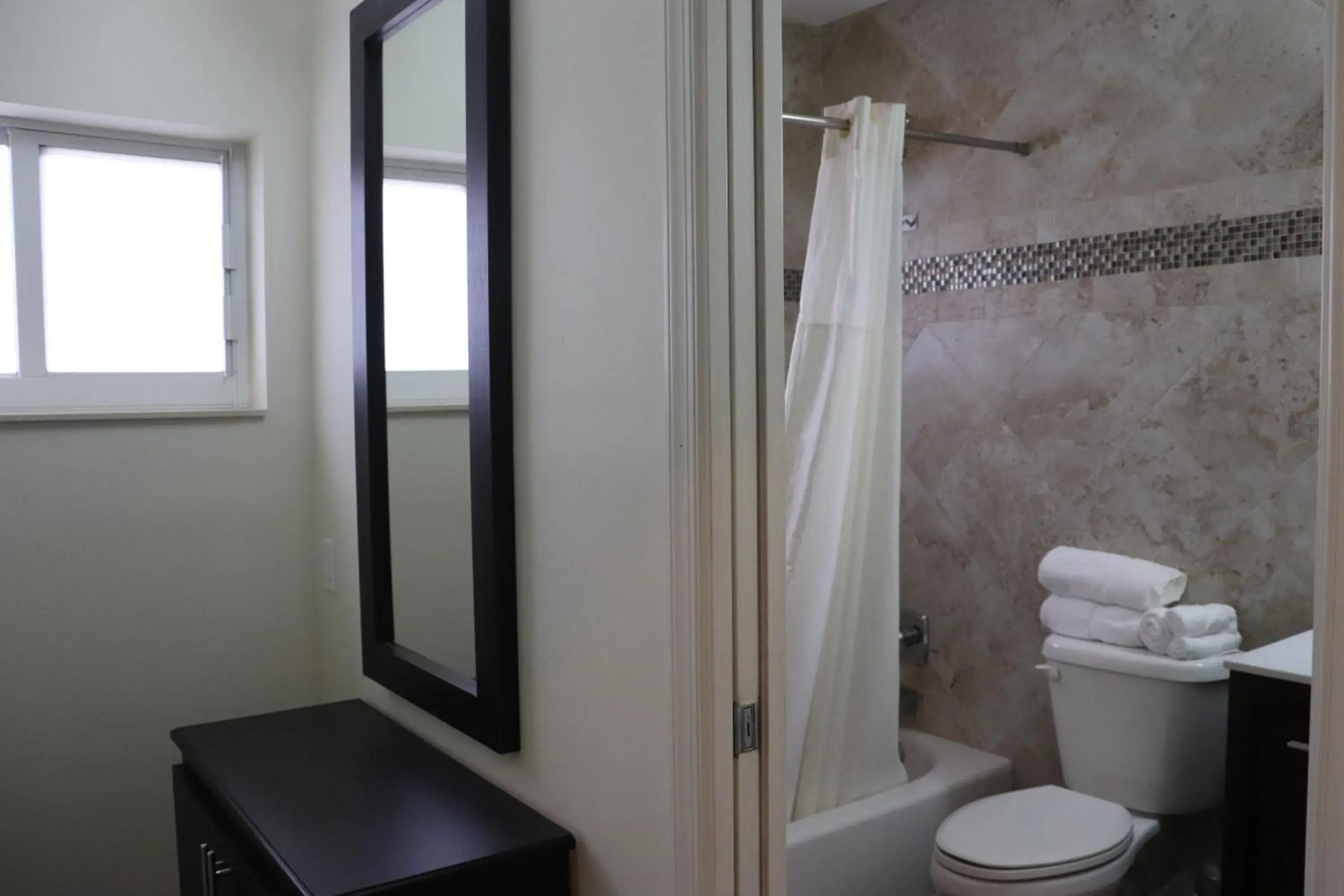 Shower, Bathroom in Curtis Inn & Suites