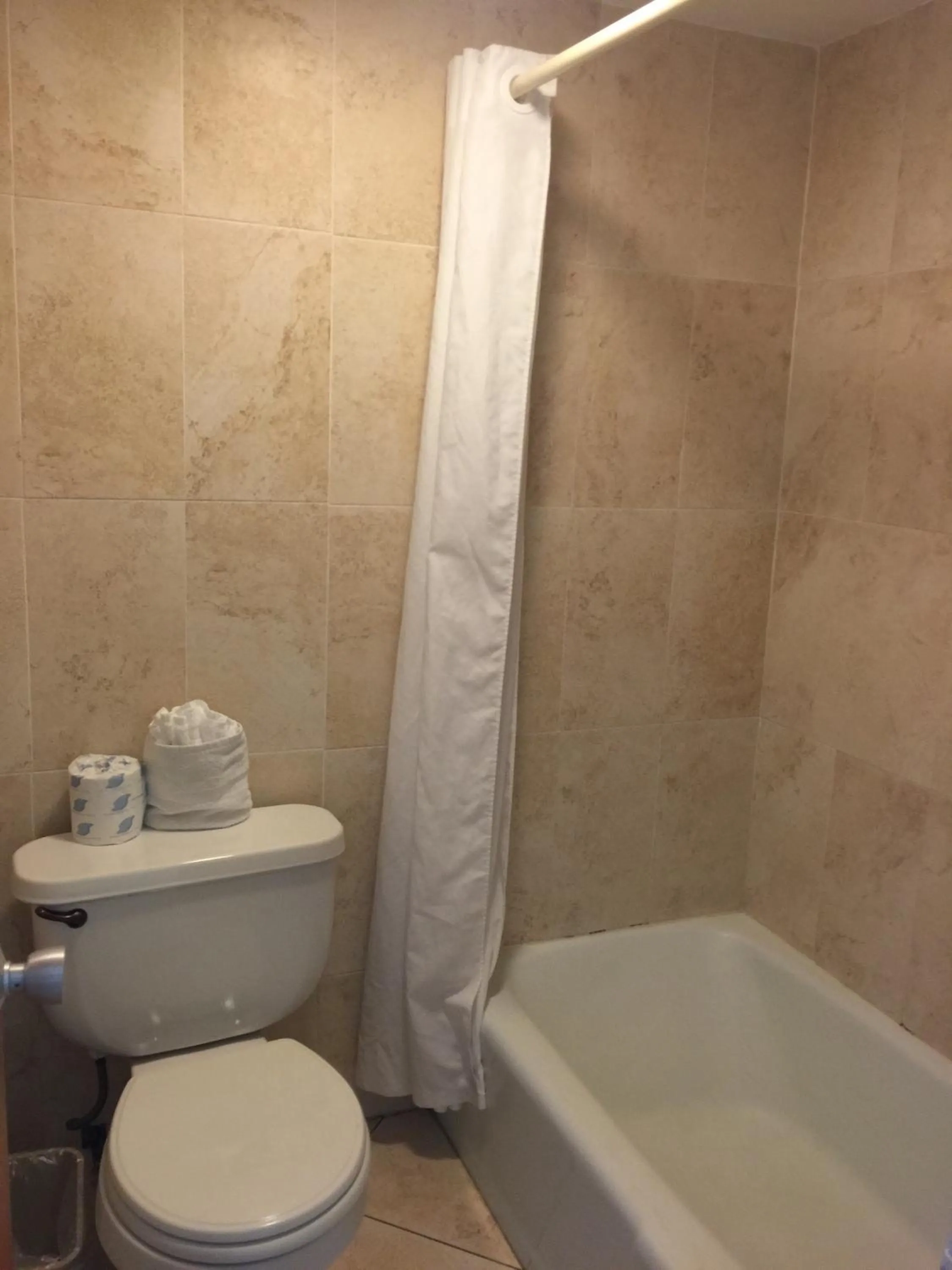 Shower in Curtis Inn & Suites