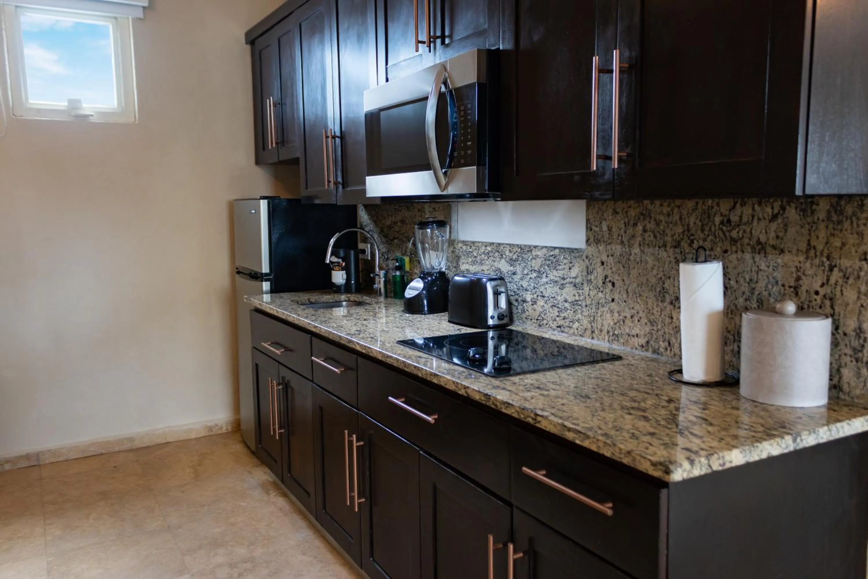 Kitchen or kitchenette in Ciqala Suites Hotel - San Juan