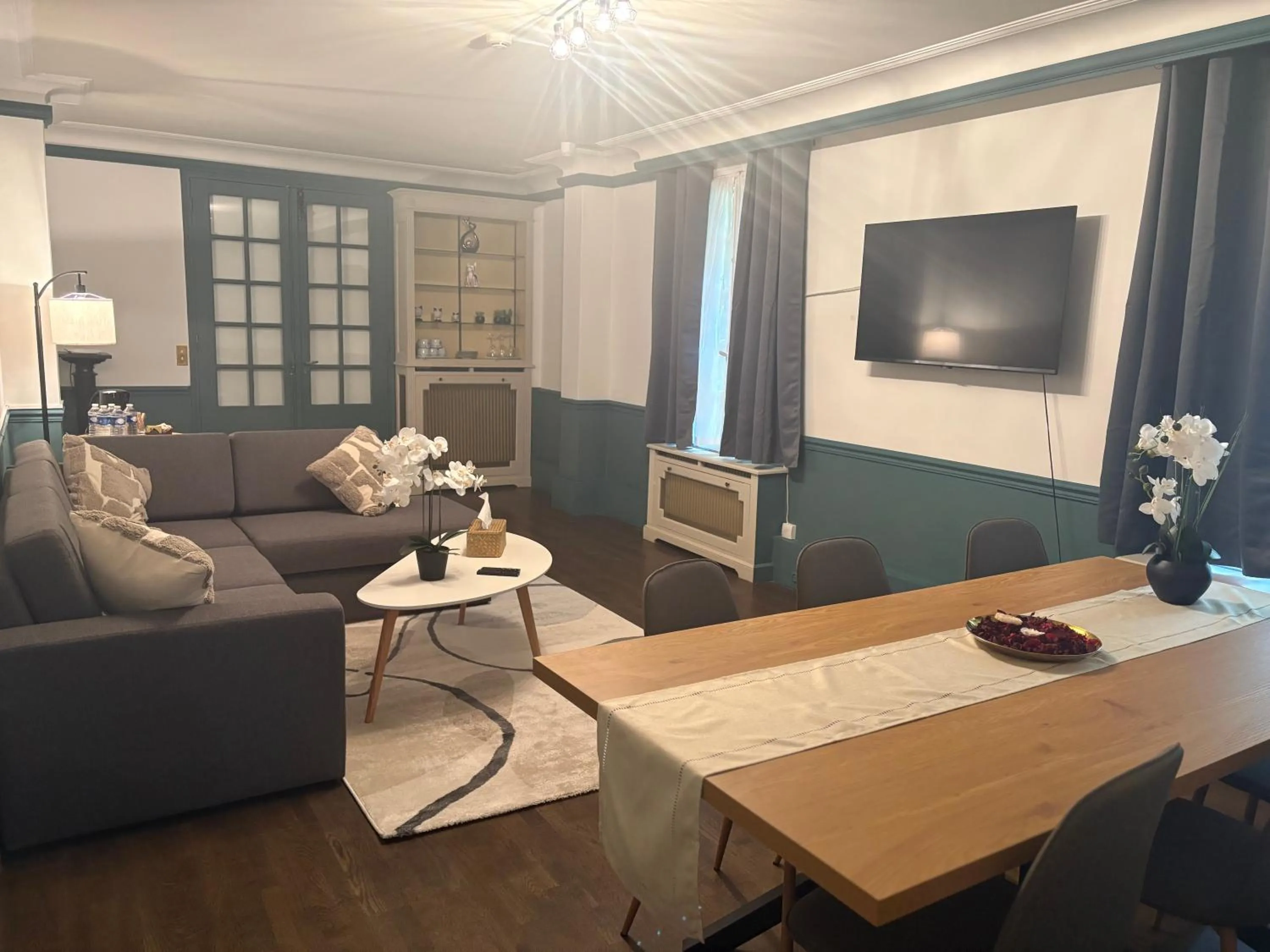 Communal lounge/ TV room in Nouvel Hôtel