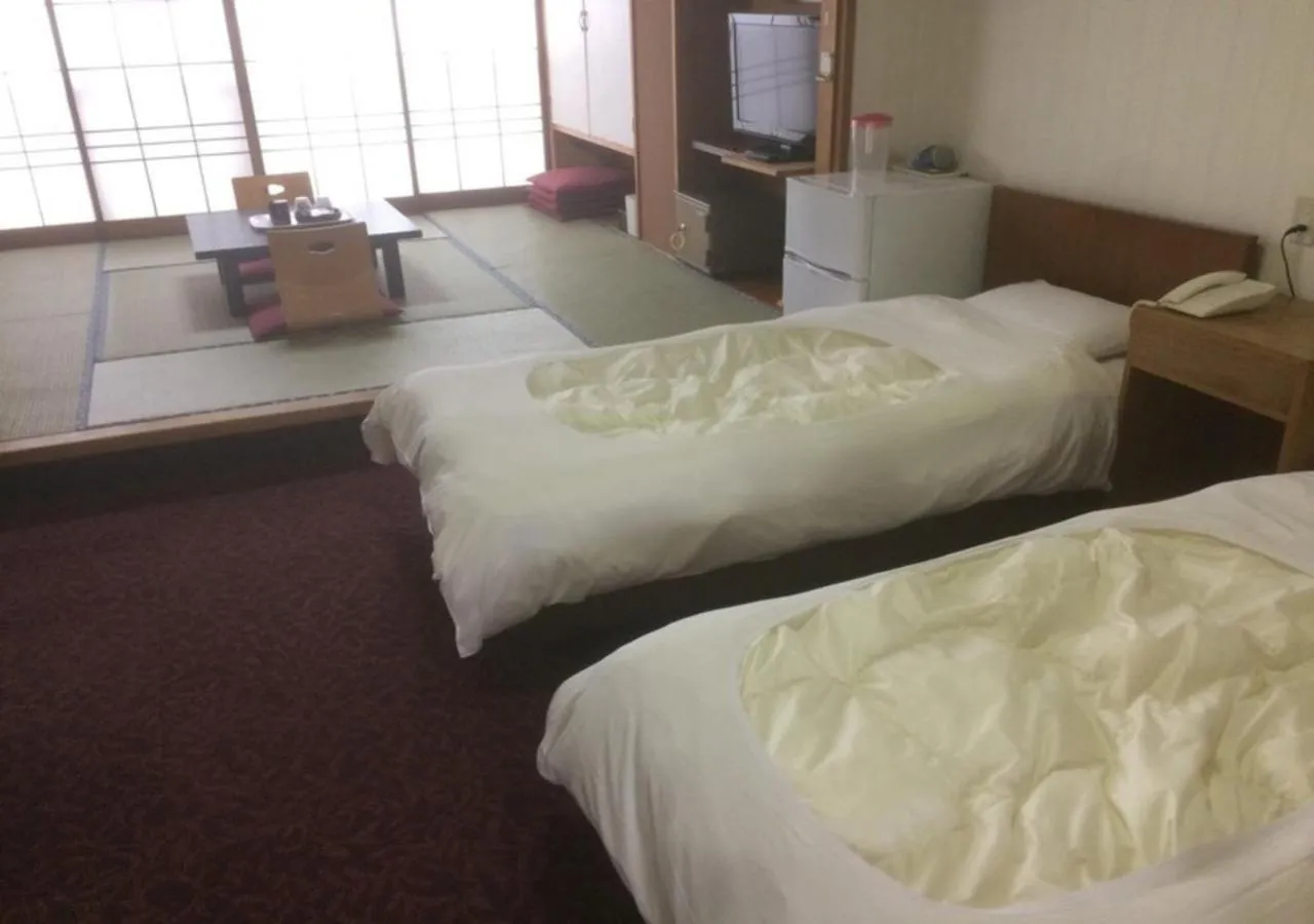 Bed in Higashiyama Park Hotel Shinfugetsu
