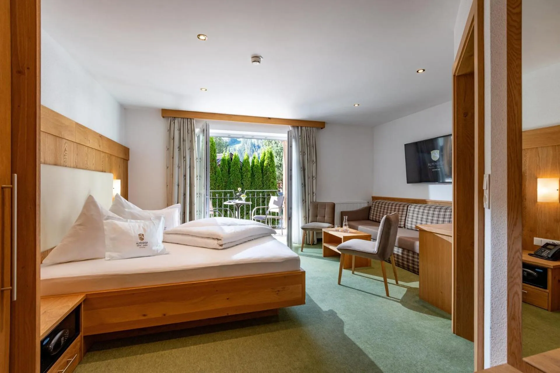 Bed in Alpenhof Hotel Garni Suprême