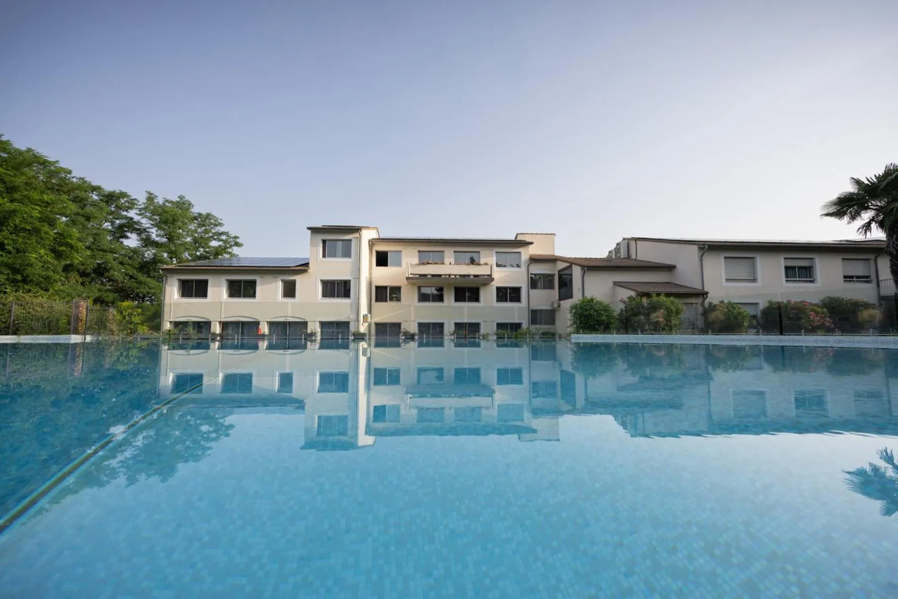 Property building in Logis Hotel Restaurant SPA Les Oliviers