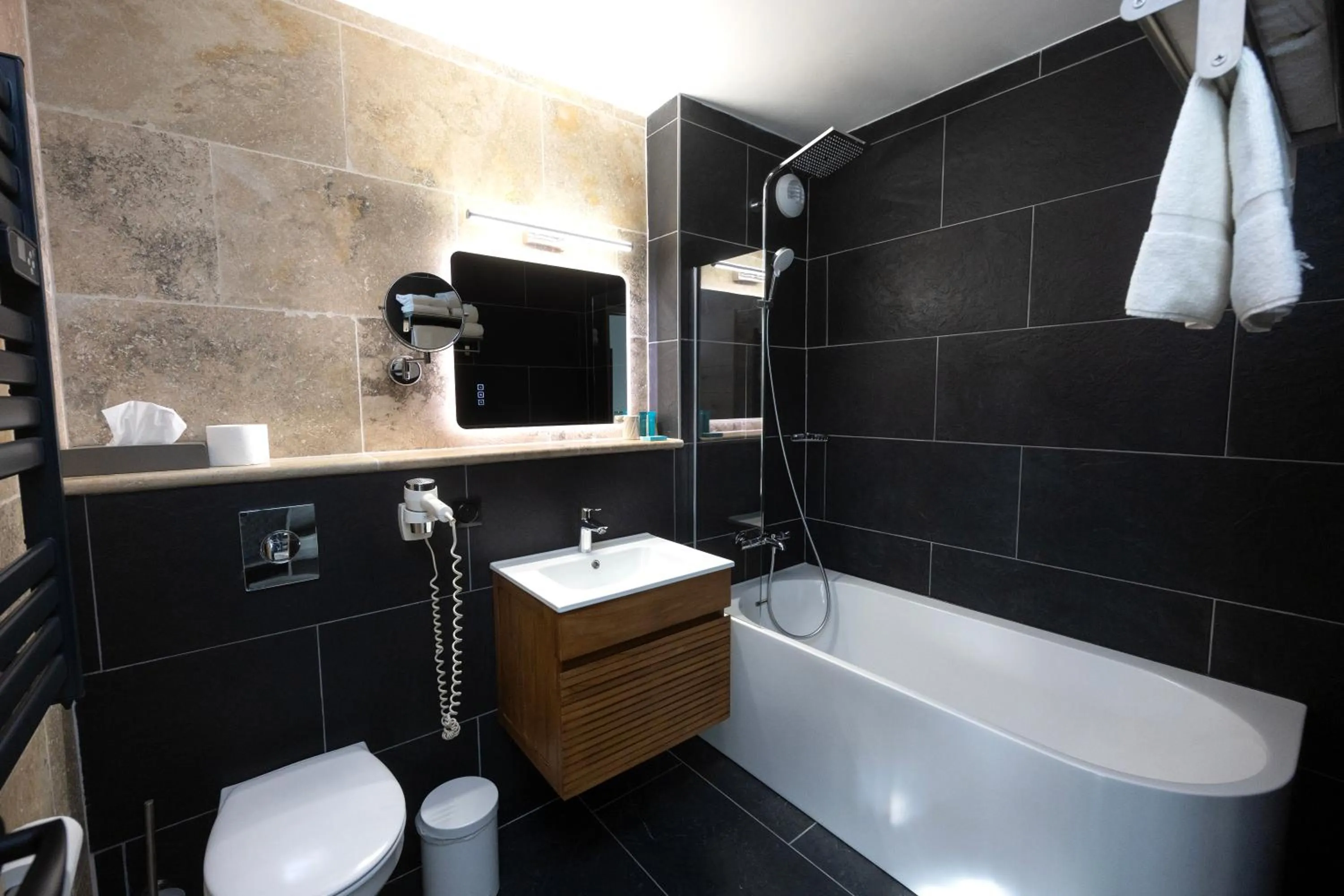 Bathroom in Logis Hotel Restaurant SPA Les Oliviers