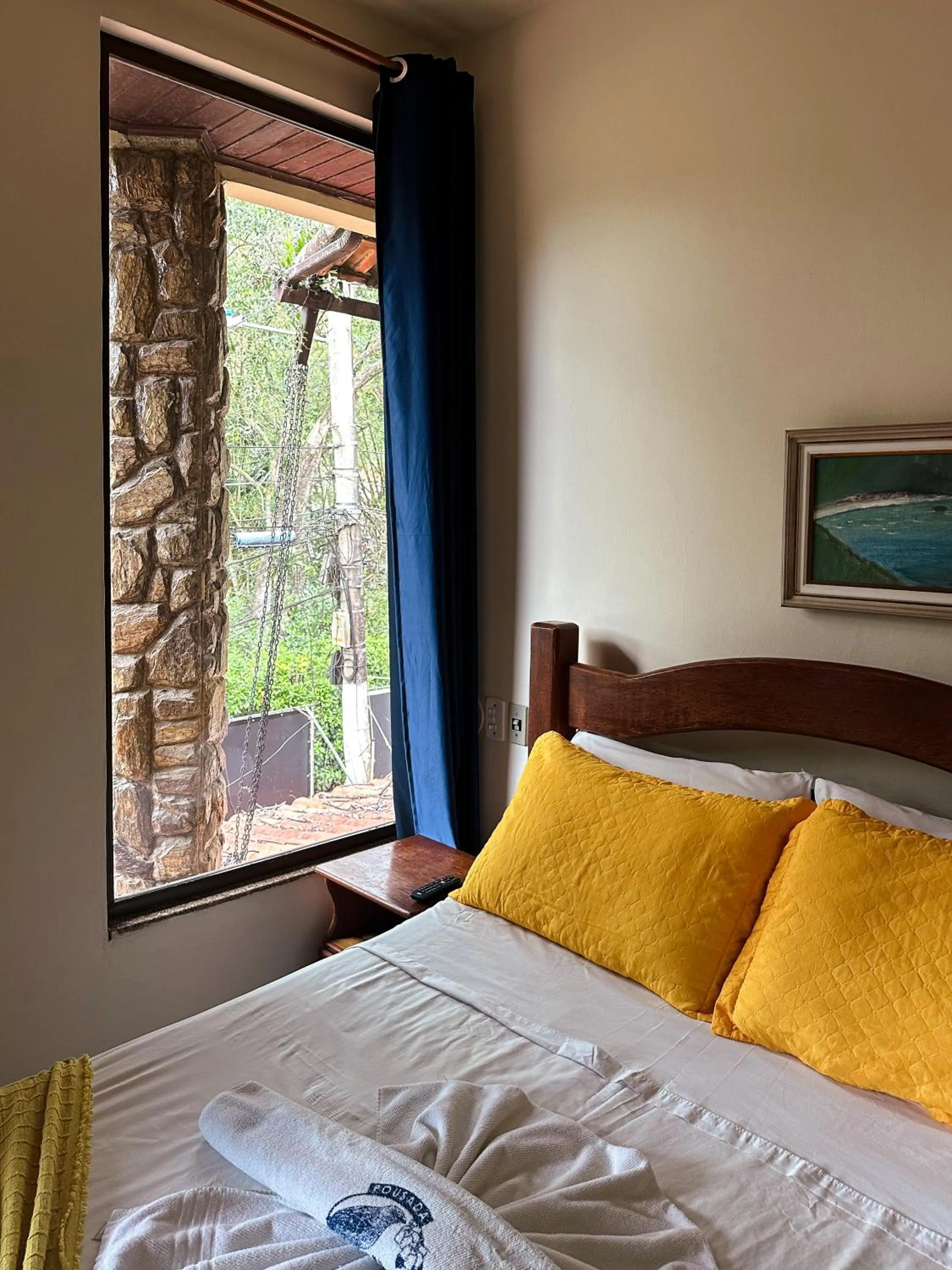 Bed in Pousada Sanhaço