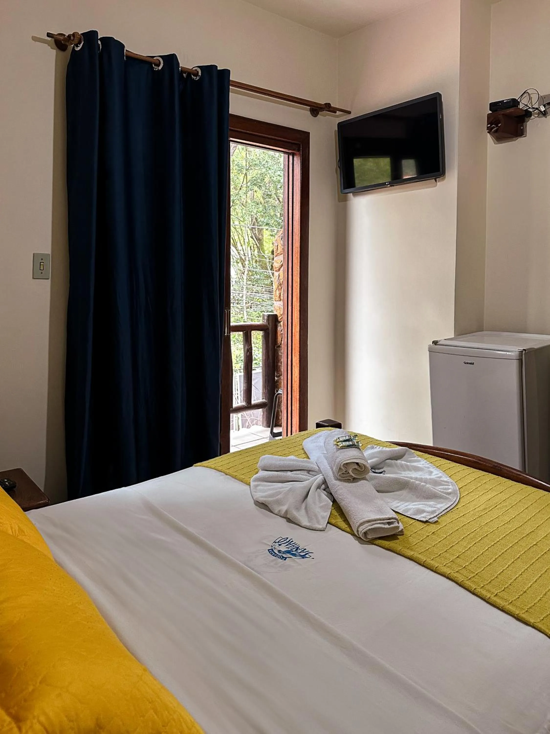 Bed in Pousada Sanhaço