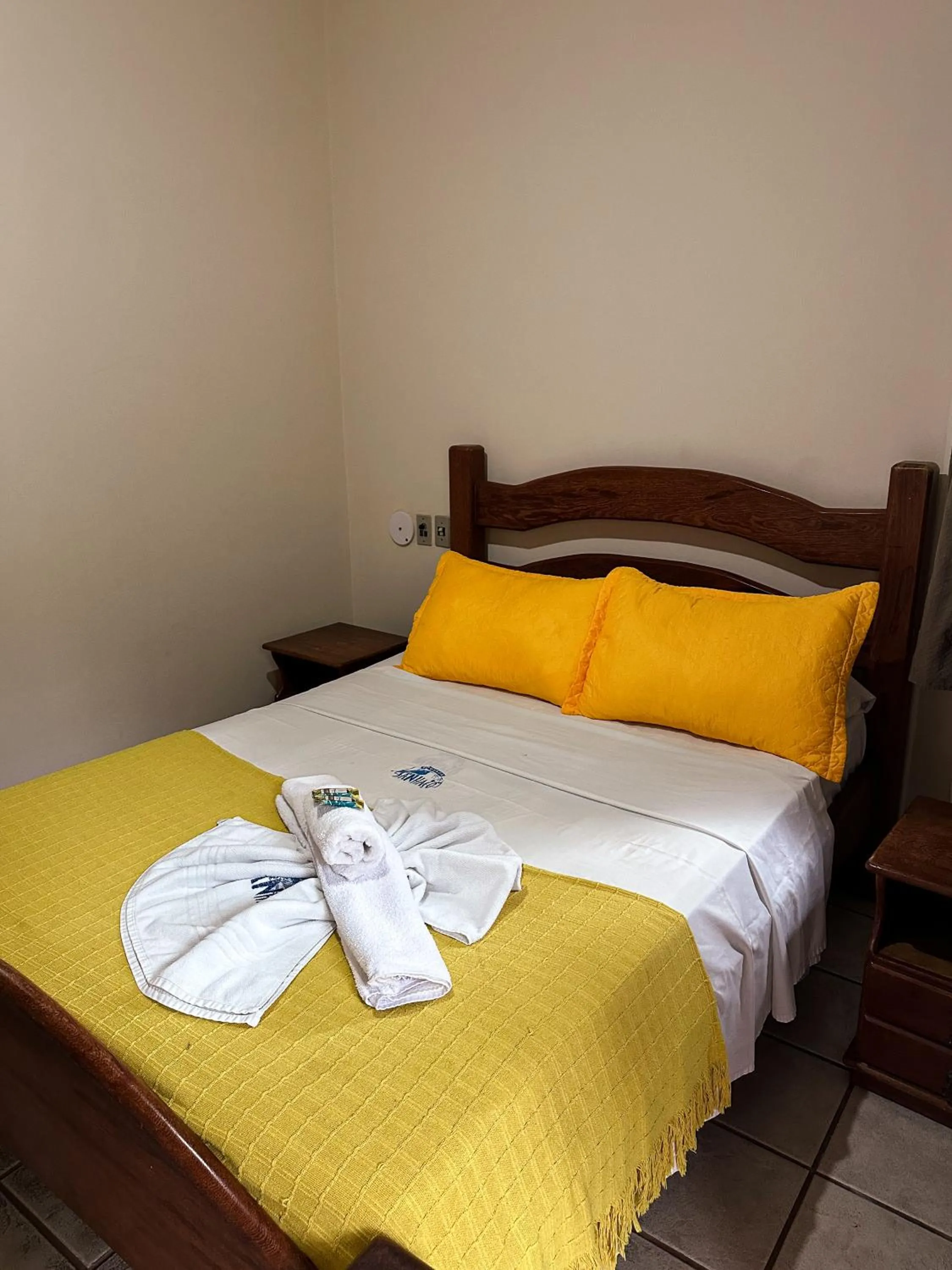 Bed in Pousada Sanhaço