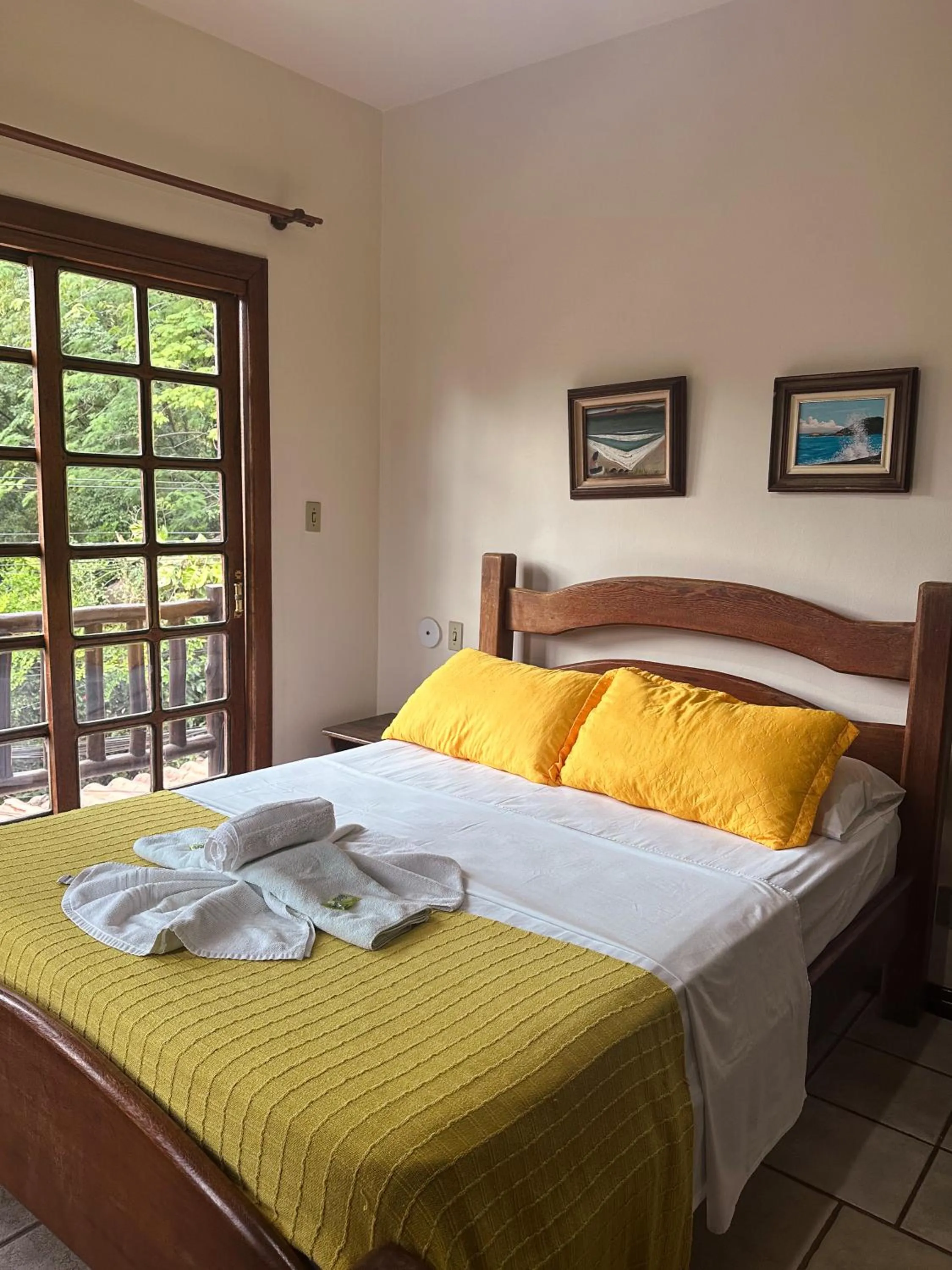 Bed in Pousada Sanhaço