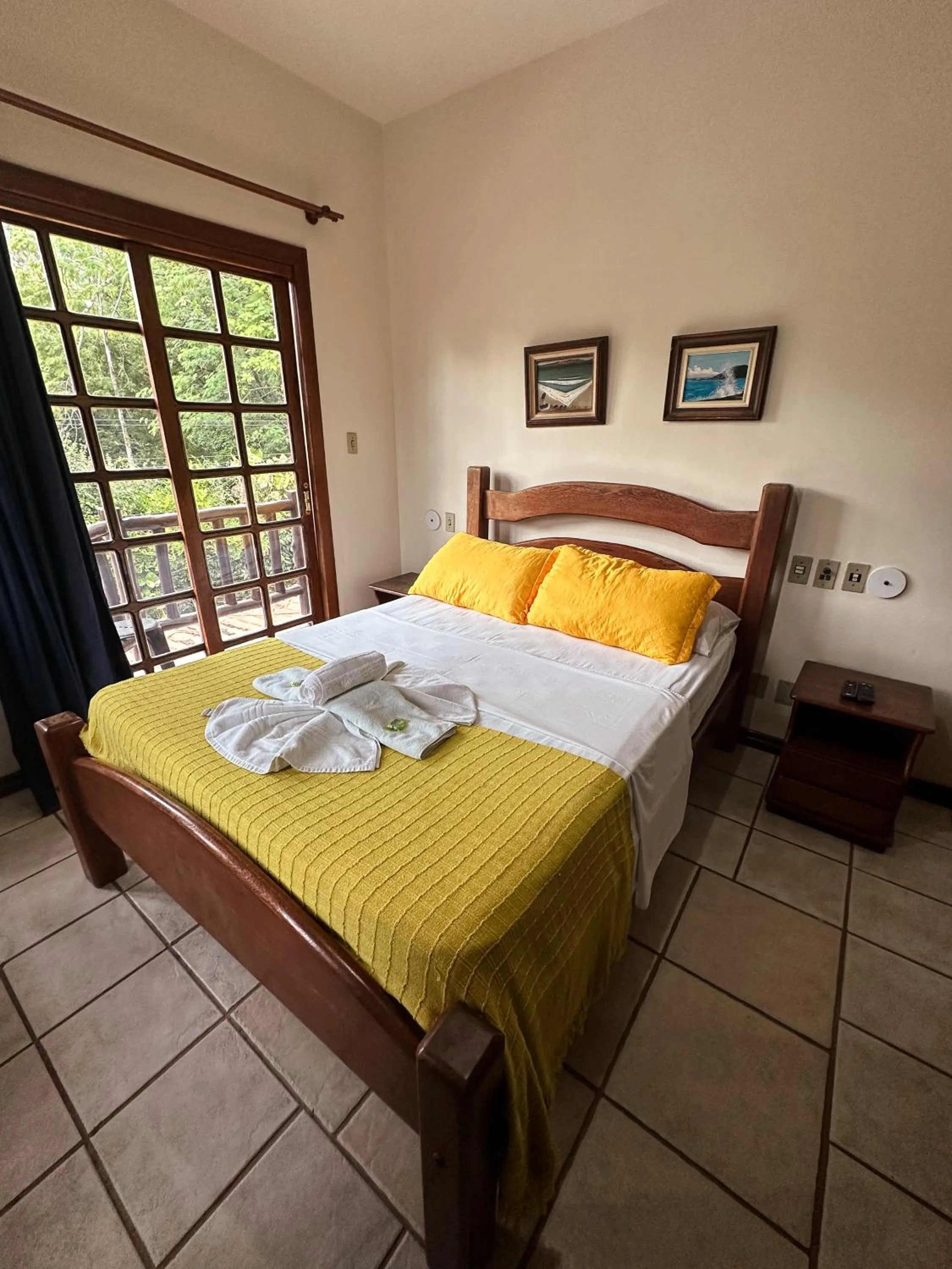 Bed in Pousada Sanhaço