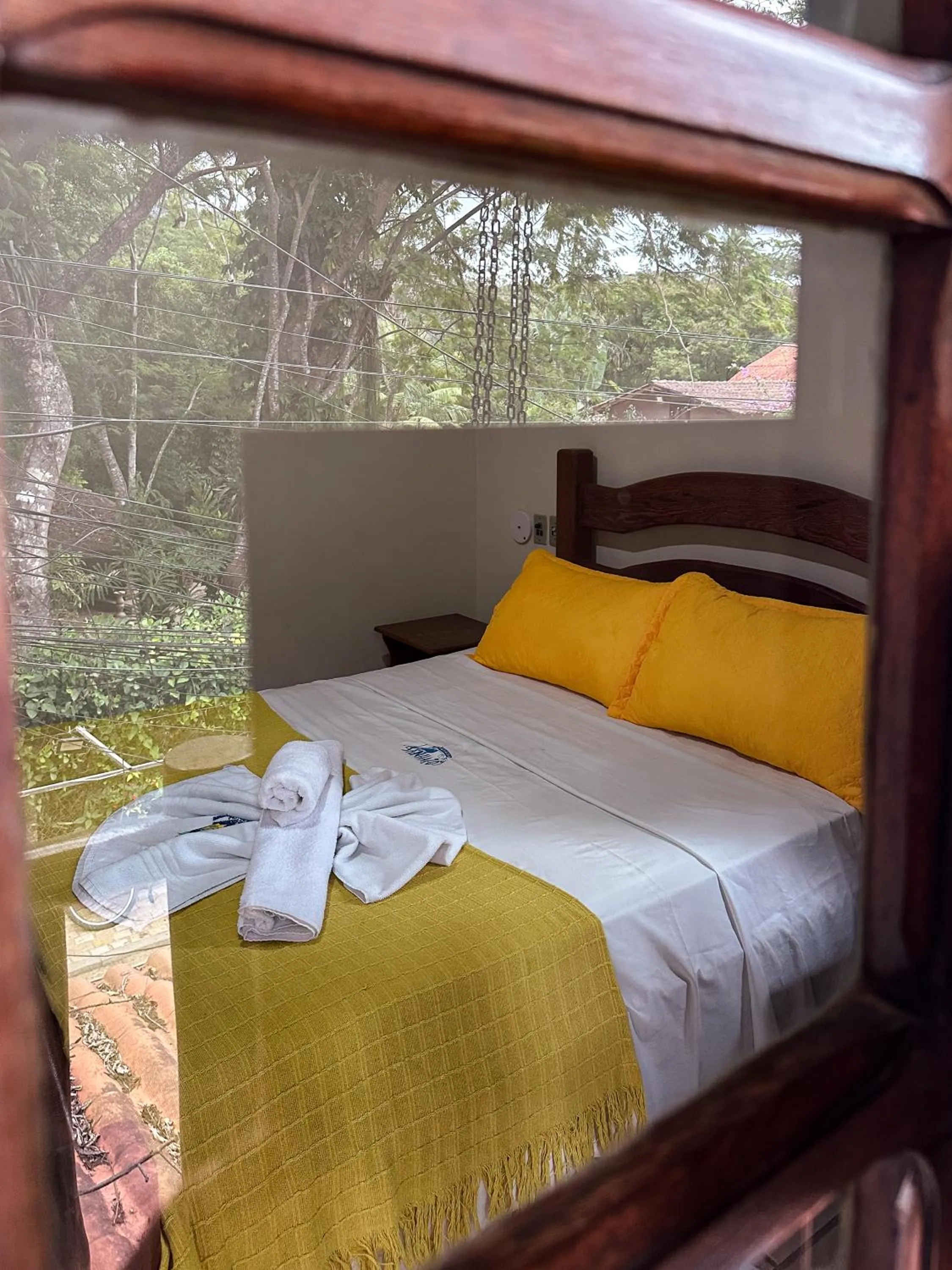 Bed in Pousada Sanhaço