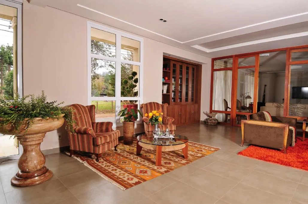 Communal lounge/ TV room in Pousada Annecy - CAPIVARI Fácil acesso ao centrinho e Baden Bar