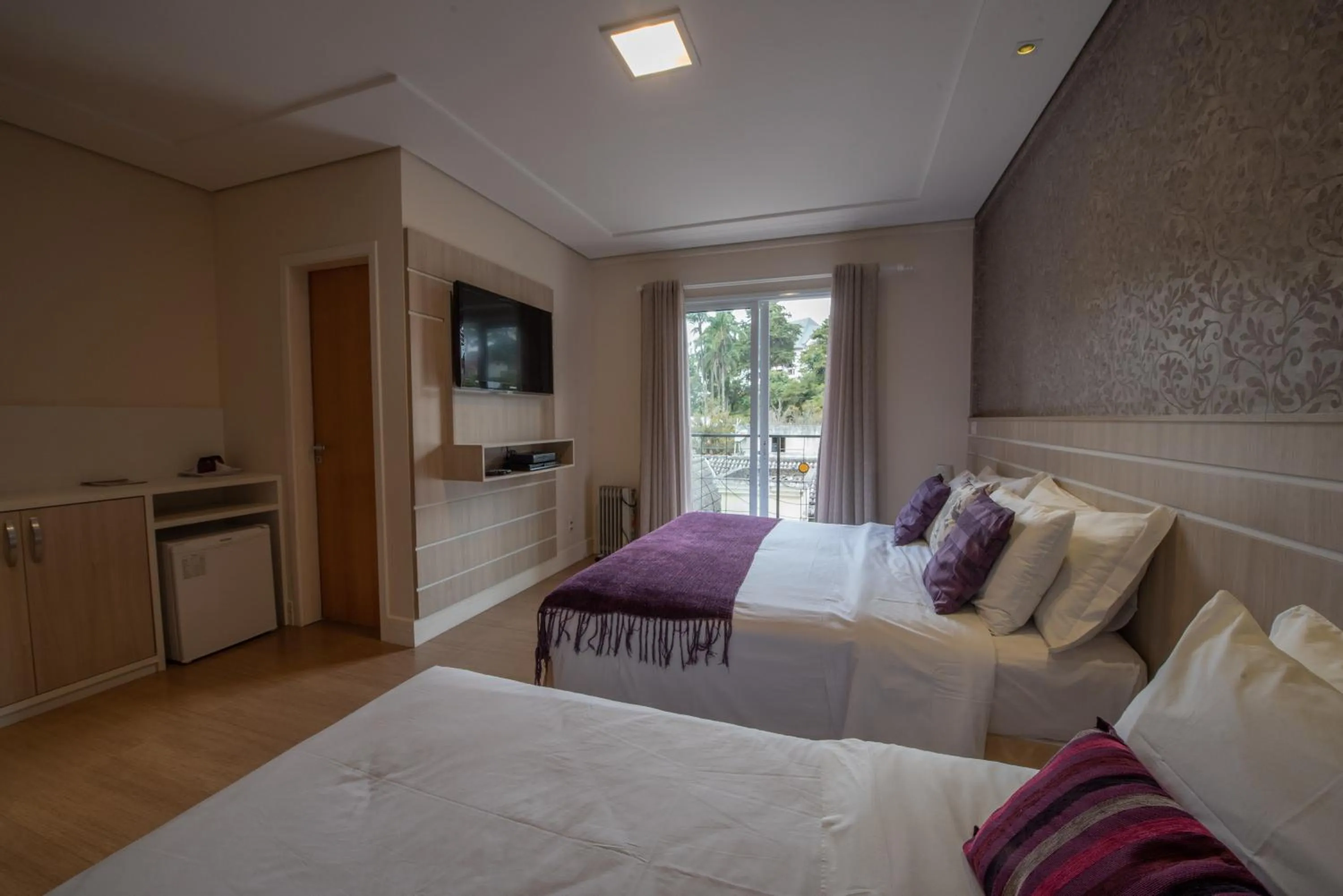 Bed in Pousada Annecy - CAPIVARI Fácil acesso ao centrinho e Baden Bar