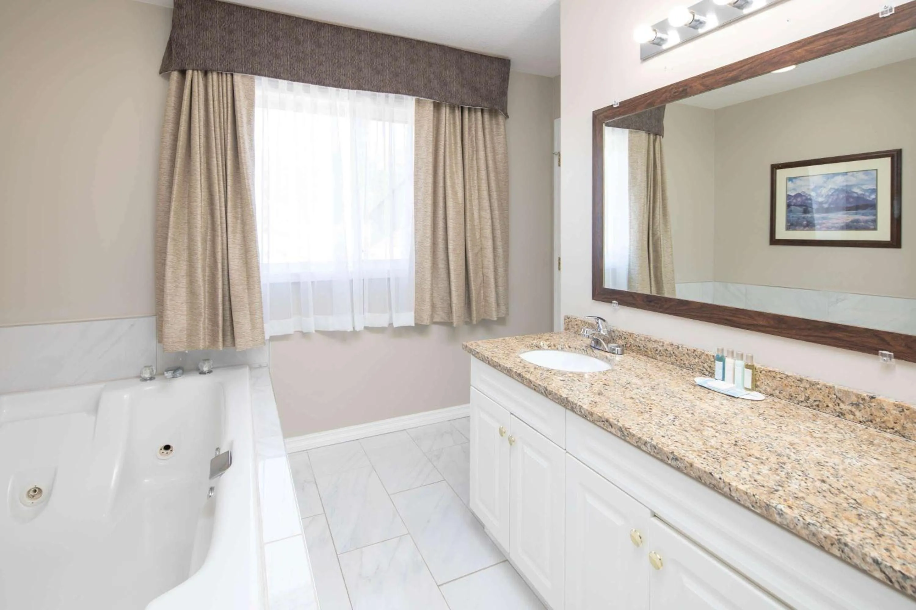 Bathroom in Travelodge by Wyndham Golden Sportsman Lodge