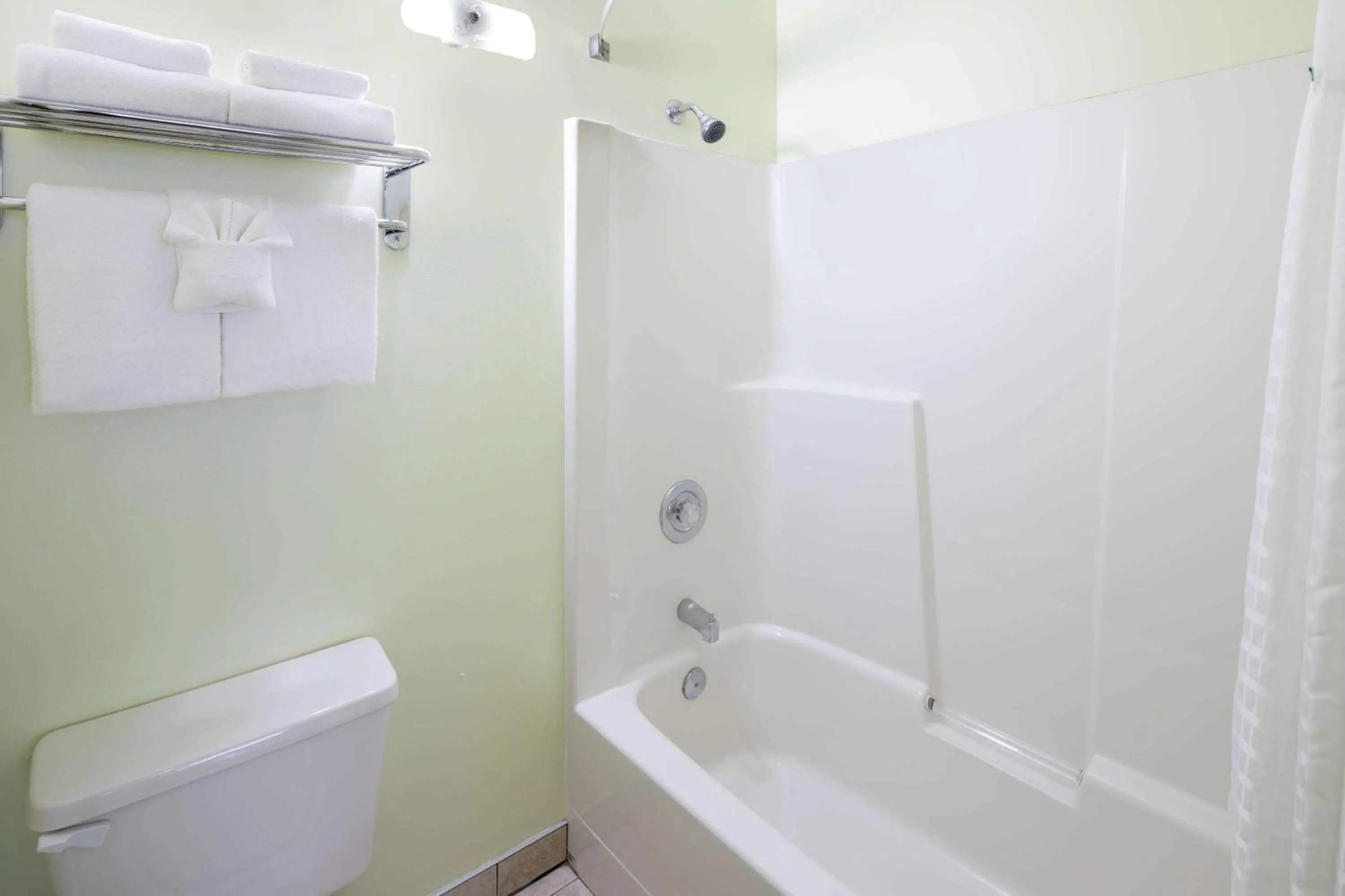 Bathroom in Travelodge by Wyndham Golden Sportsman Lodge