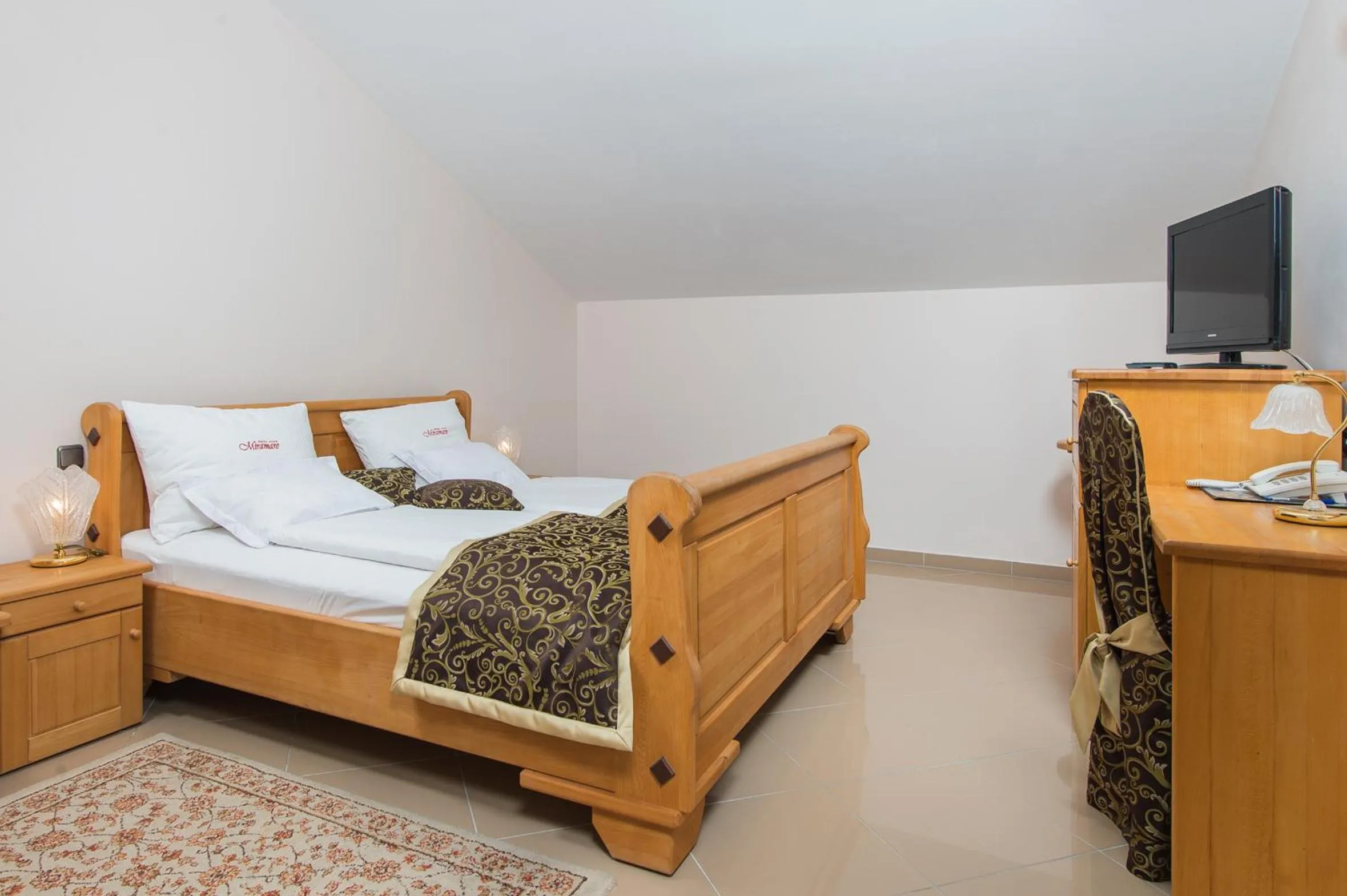 Bed in Hotel Miramare