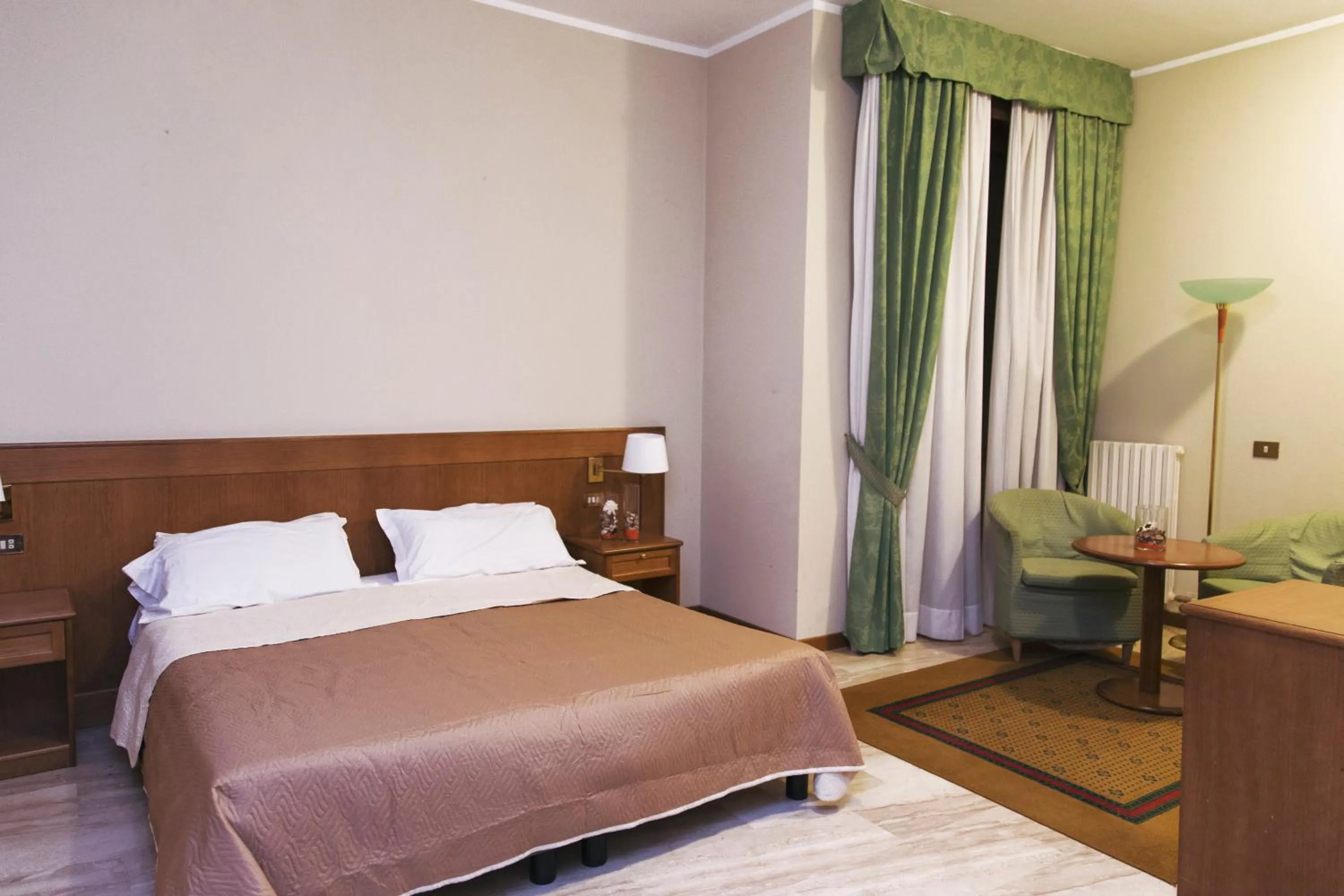 Bed in Hotel Clementi