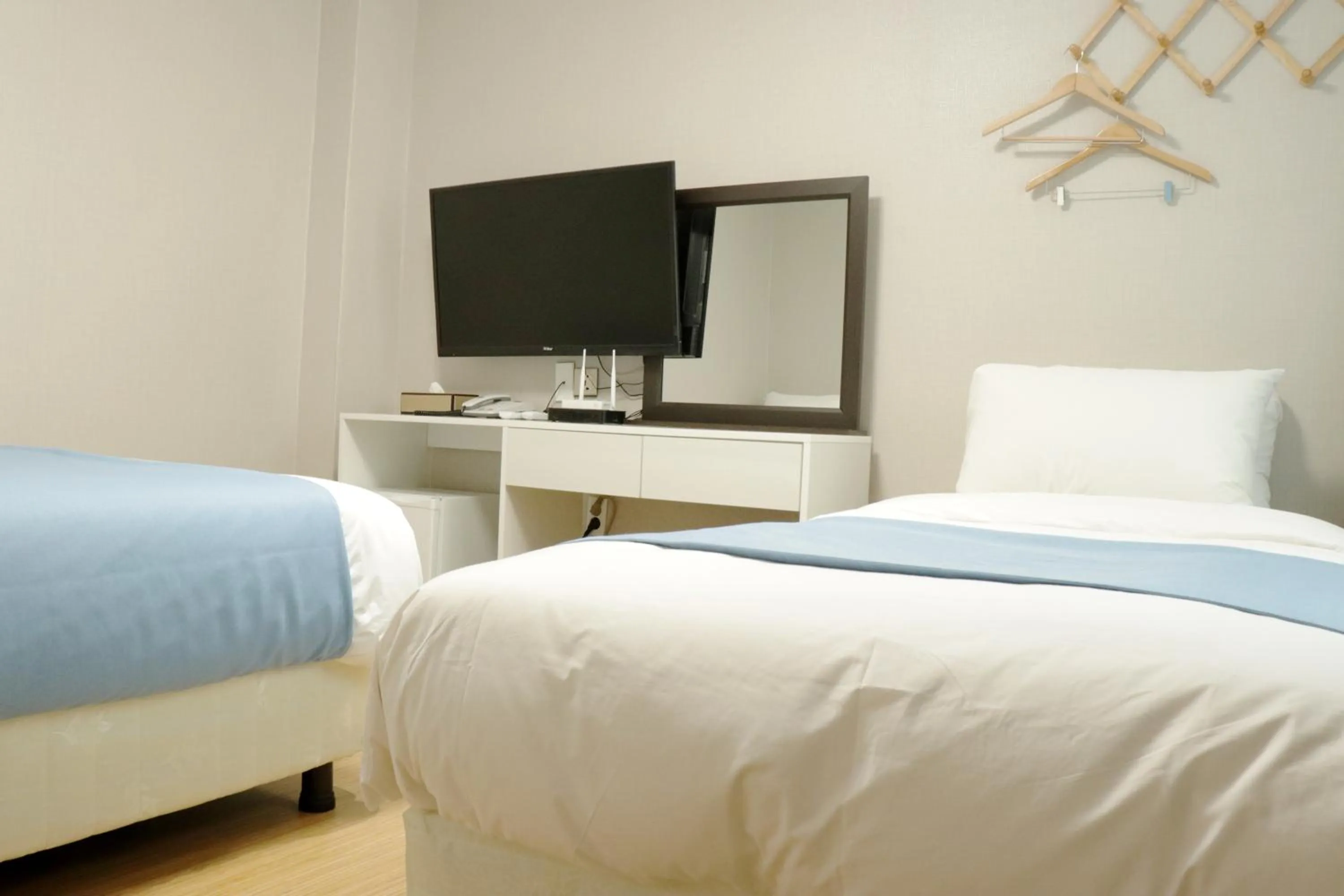 Bedroom, TV/Entertainment Center in Ora Stay Hotel