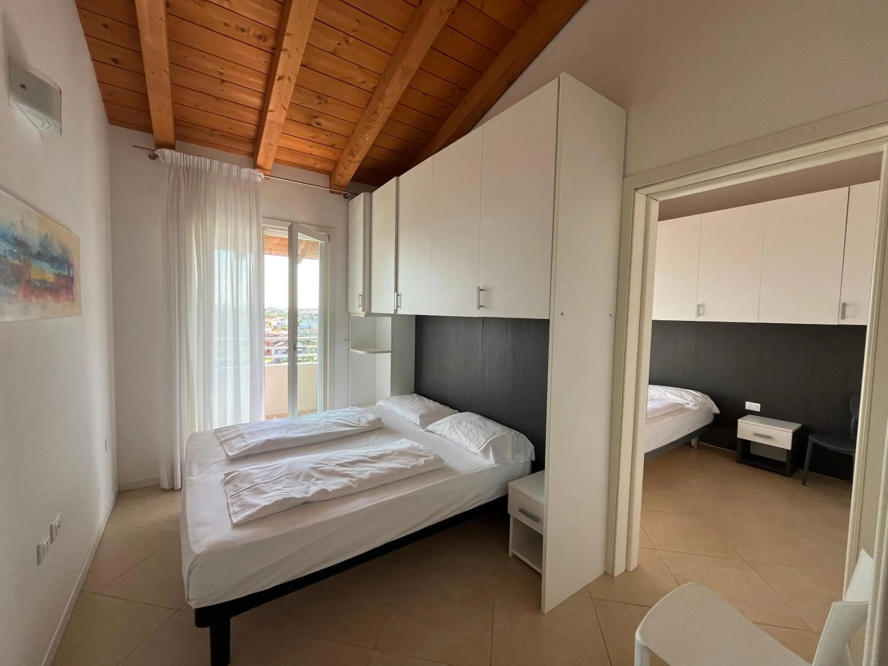 Bed in Villaggio Hemingway - Family Aparthotel