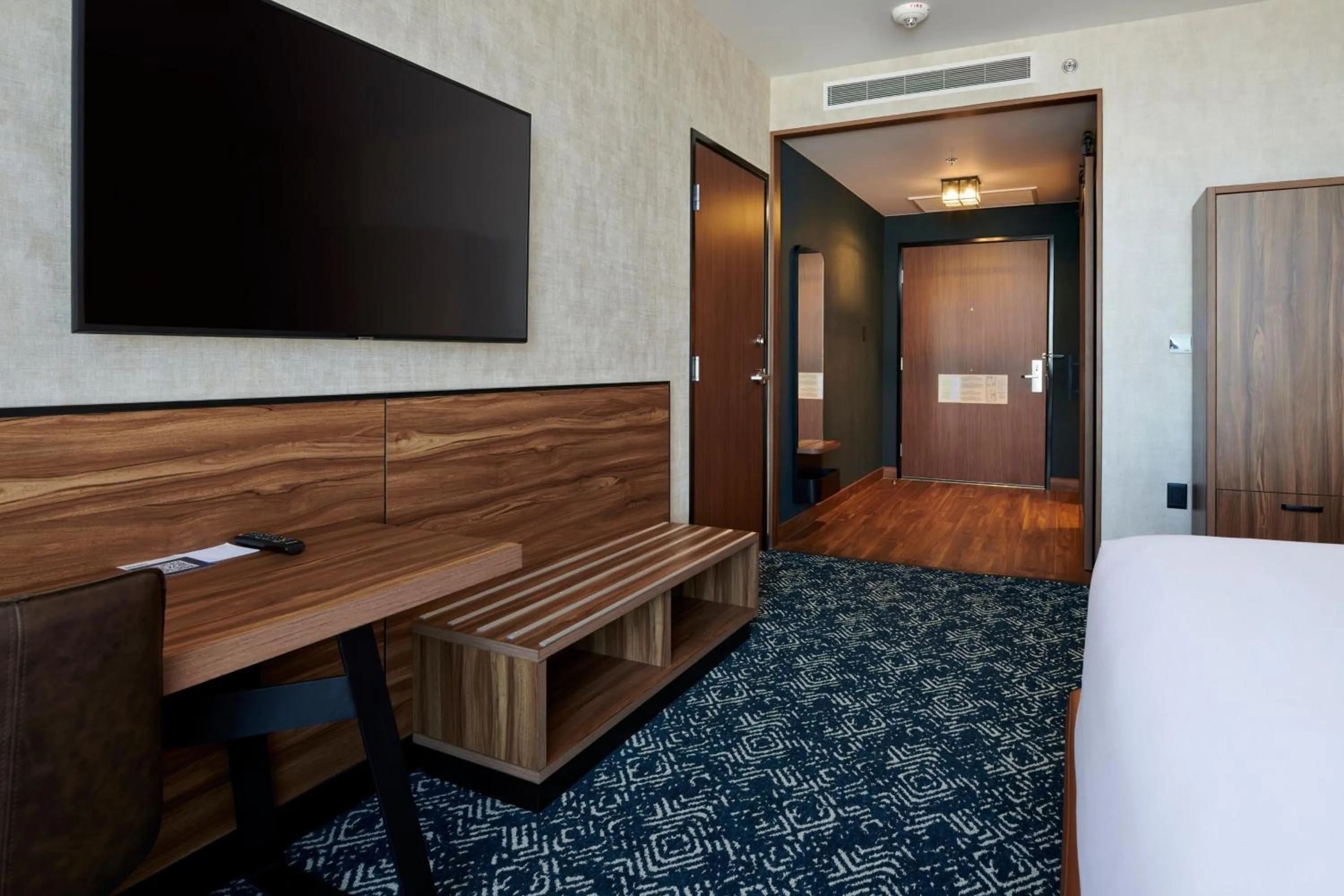 Photo of the whole room, Bed in Four Points by Sheraton Distrito Uno Chihuahua