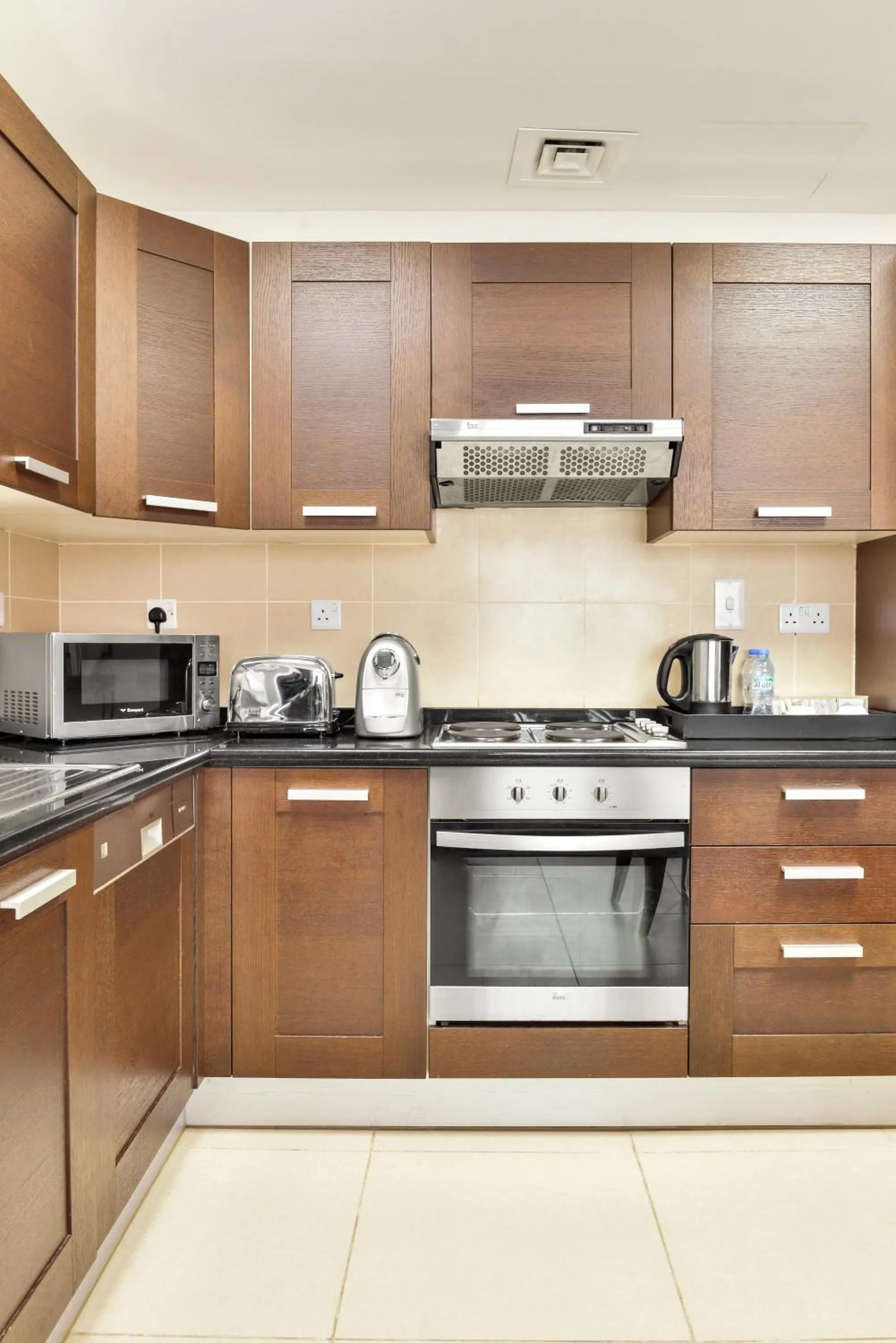 Kitchen or kitchenette in Nassima Tower Hotel Apartments