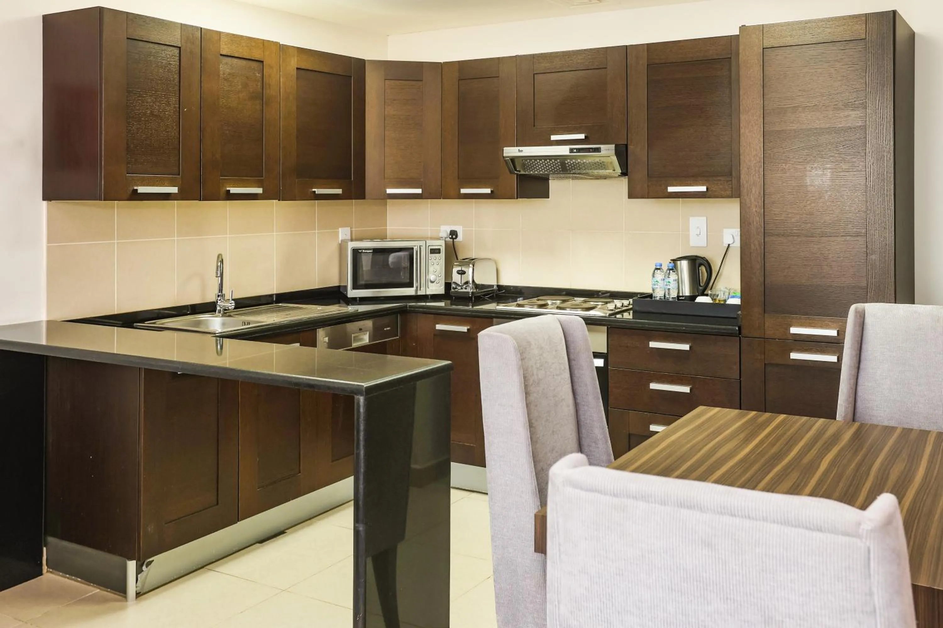 Kitchen or kitchenette in Nassima Tower Hotel Apartments