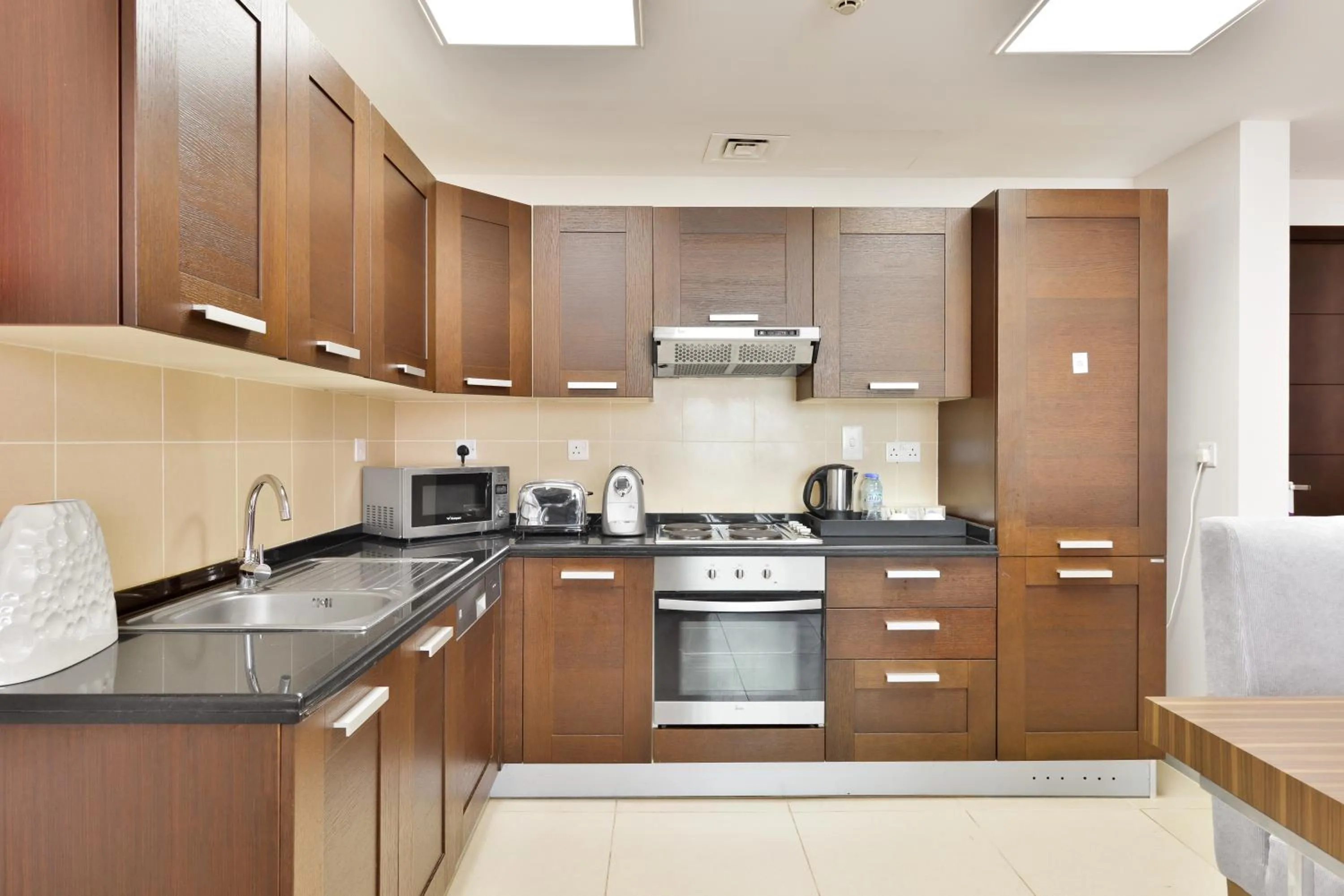 Kitchen or kitchenette in Nassima Tower Hotel Apartments