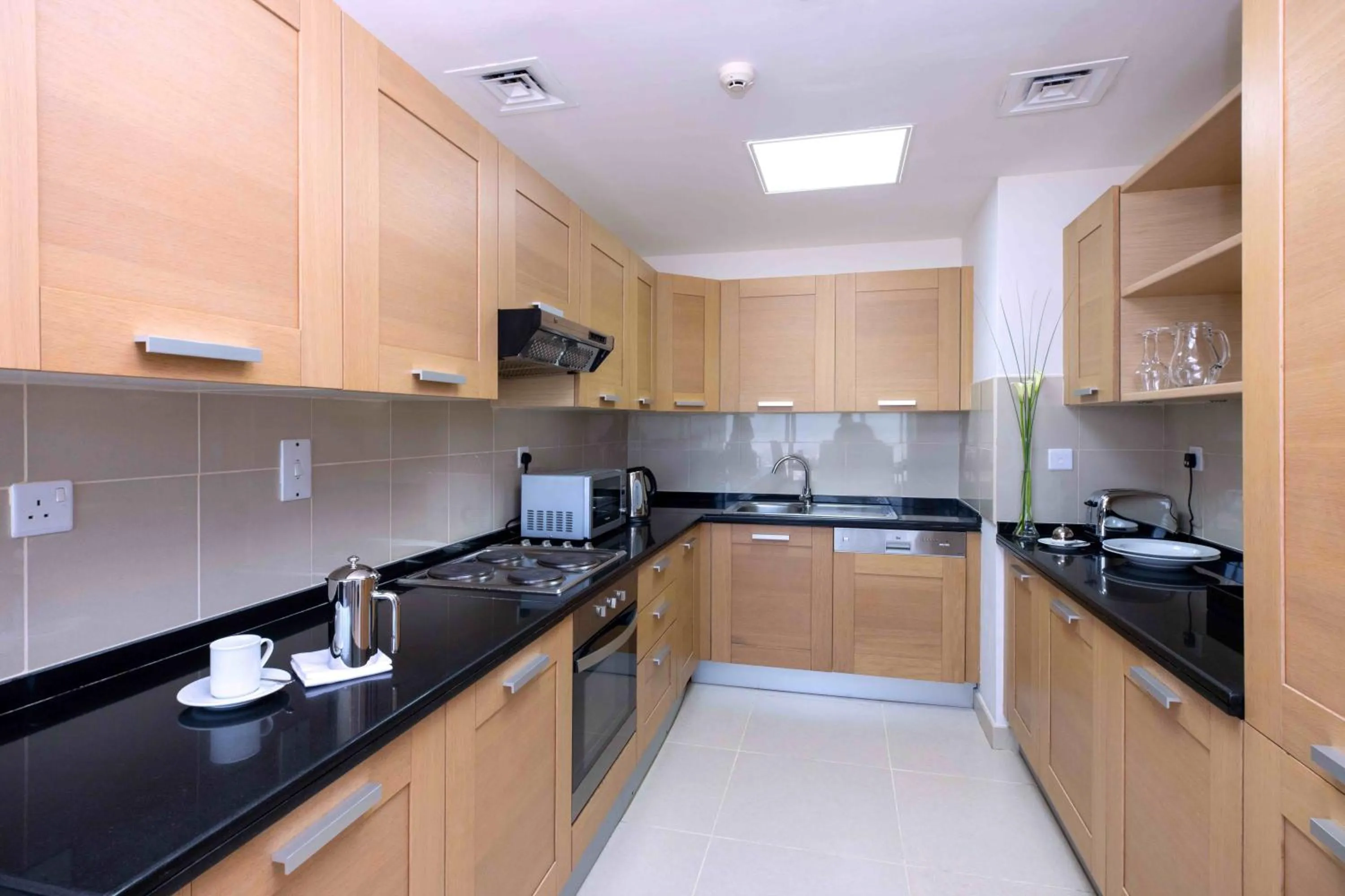 Kitchen or kitchenette in Nassima Tower Hotel Apartments