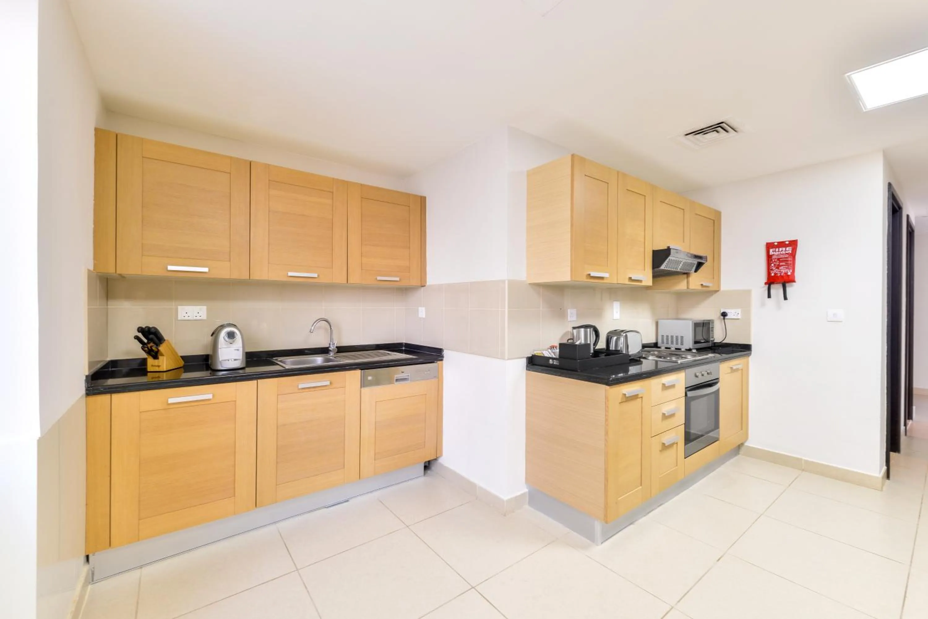 Kitchen or kitchenette in Nassima Tower Hotel Apartments