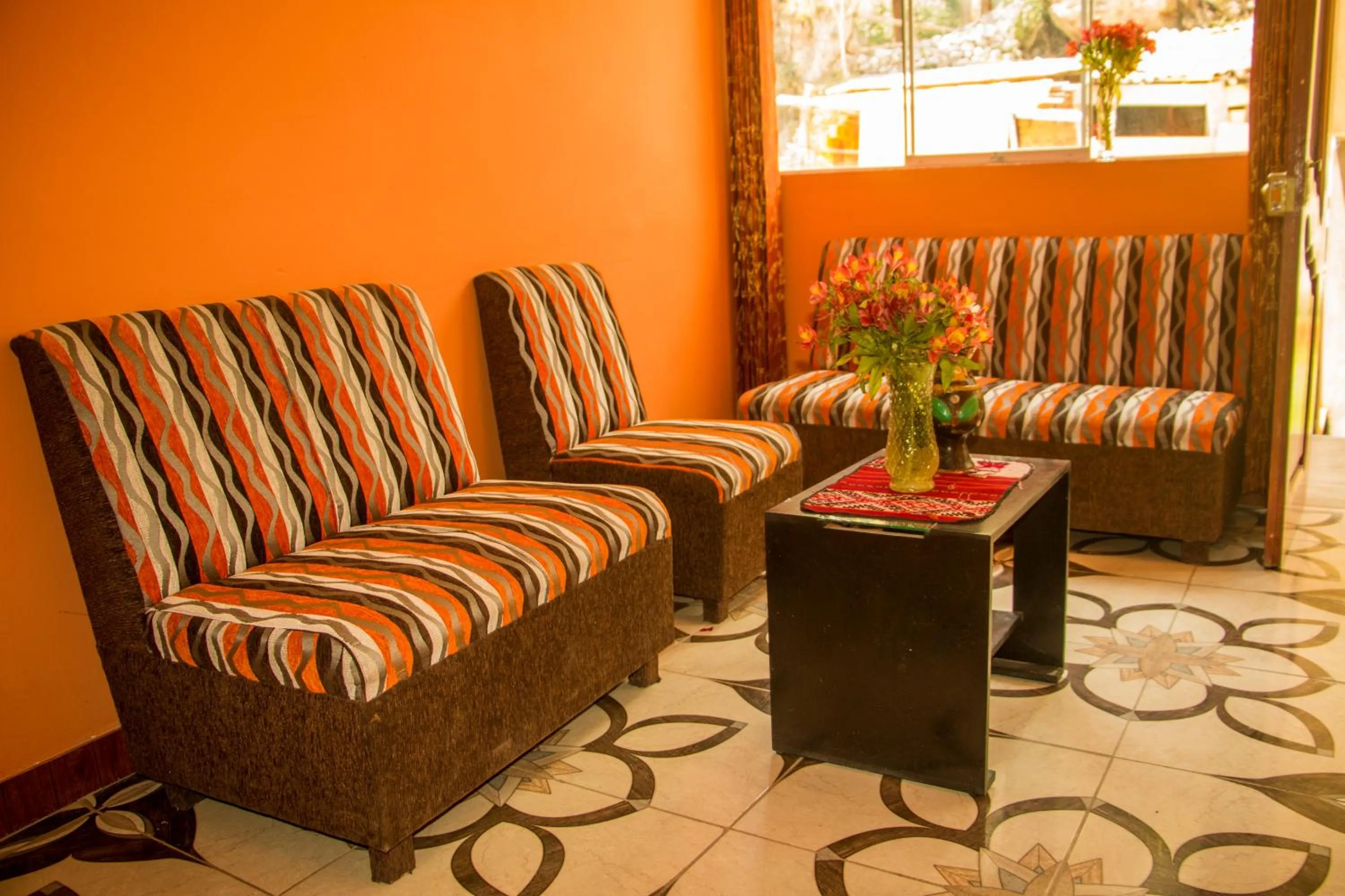 Communal lounge/ TV room in Inka Khawarina Tambo Lodge