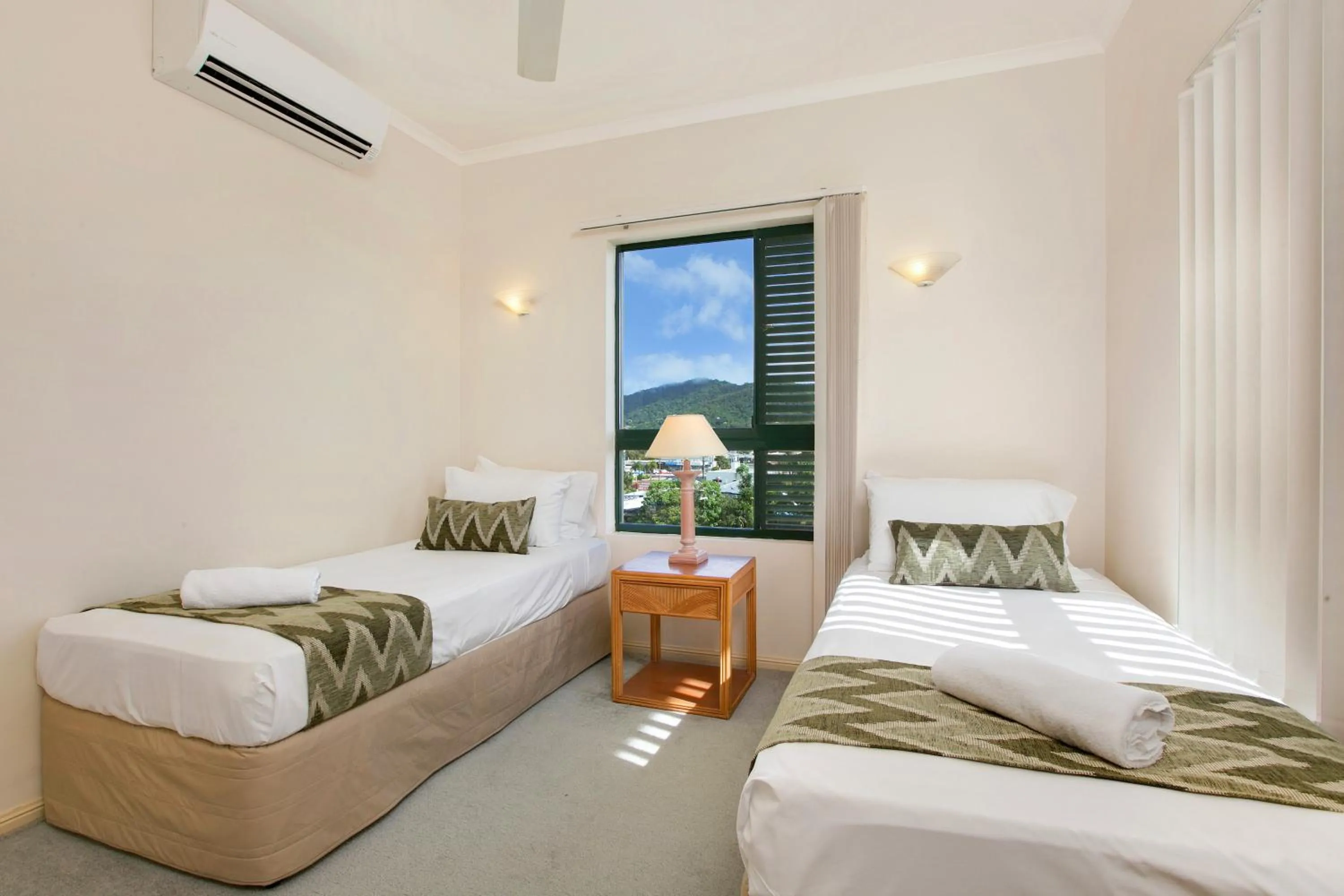 Bed in Tropic Towers Apartments