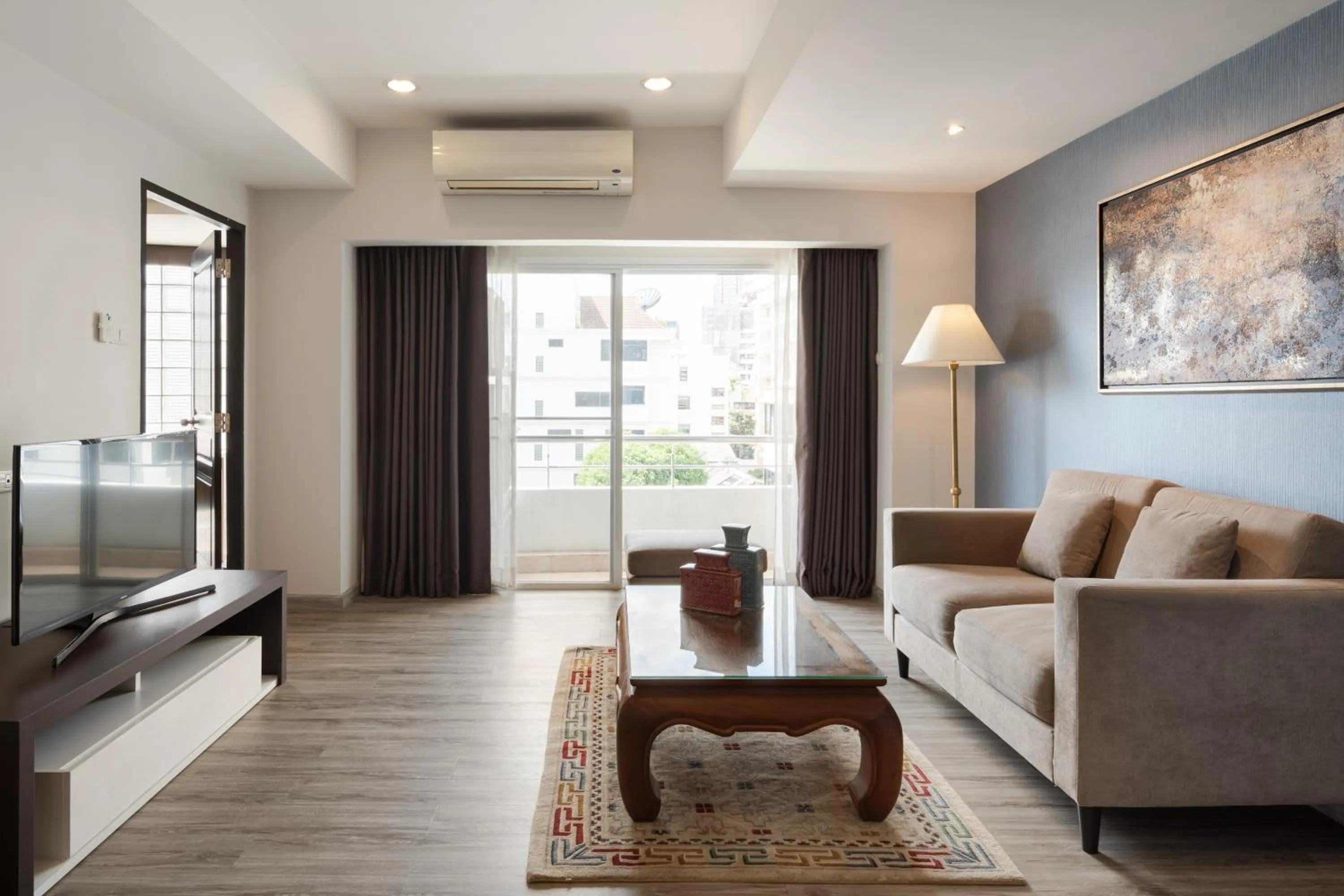 Living room, Bed in Aspira Residence Ruamrudee