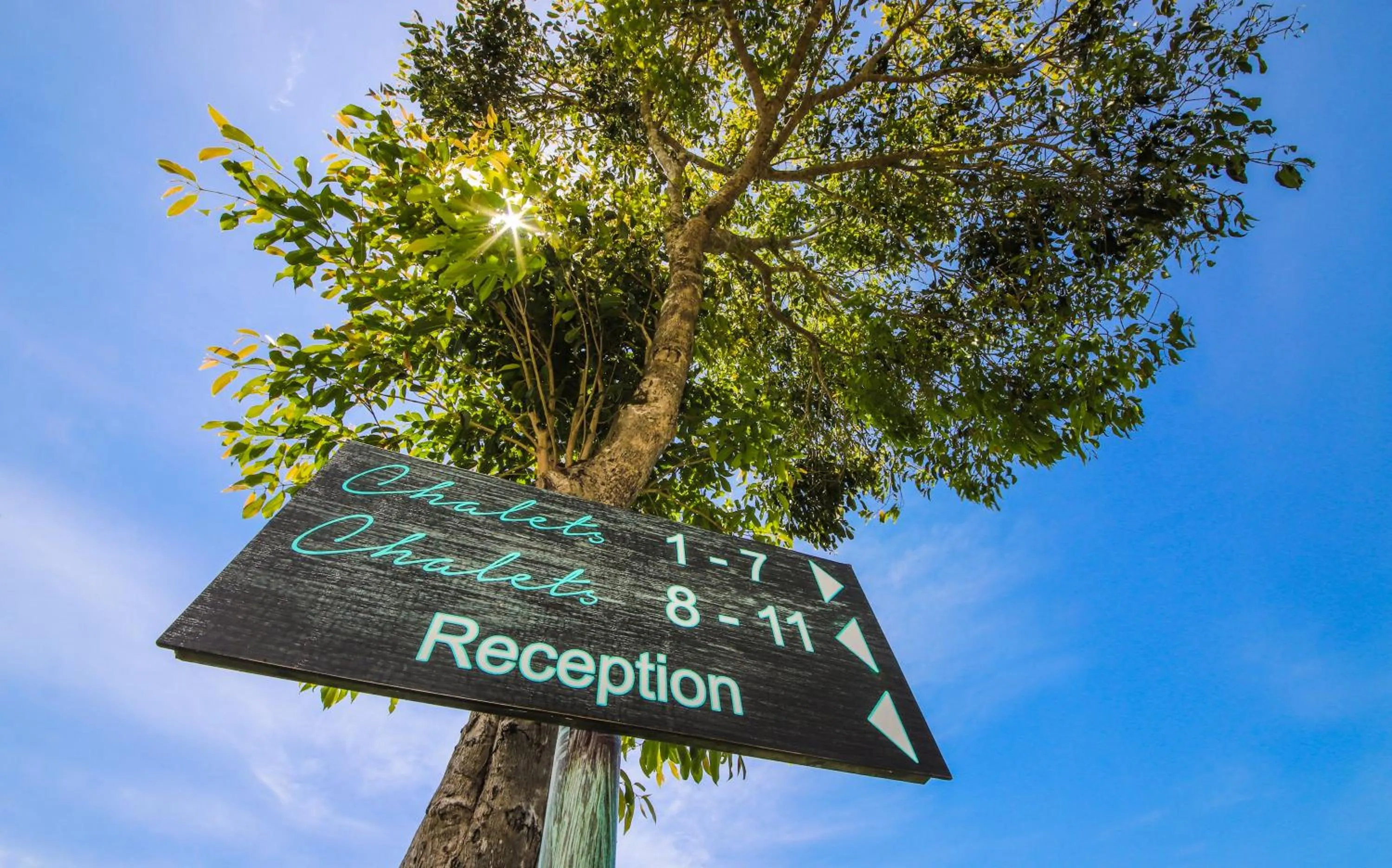 Property logo or sign in Hotel Chalets Chamarel