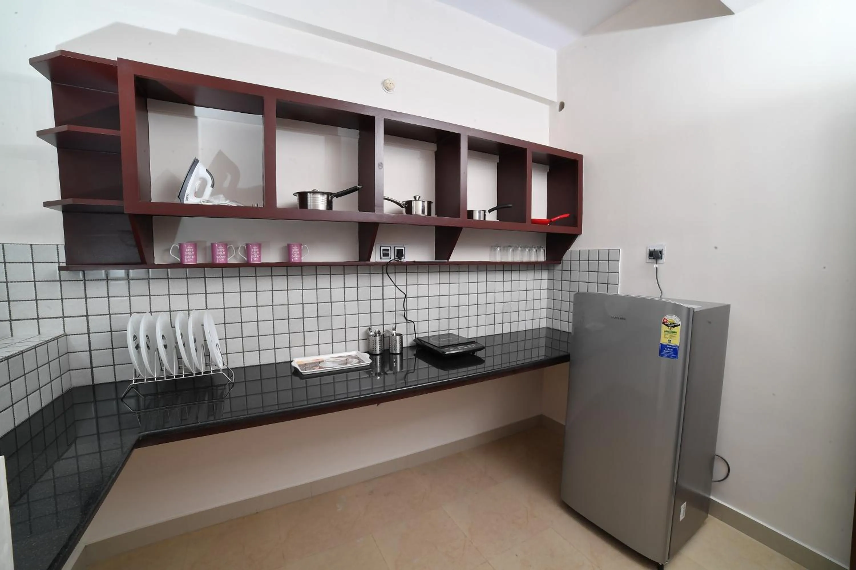 Kitchen or kitchenette in Indeevaram Residency