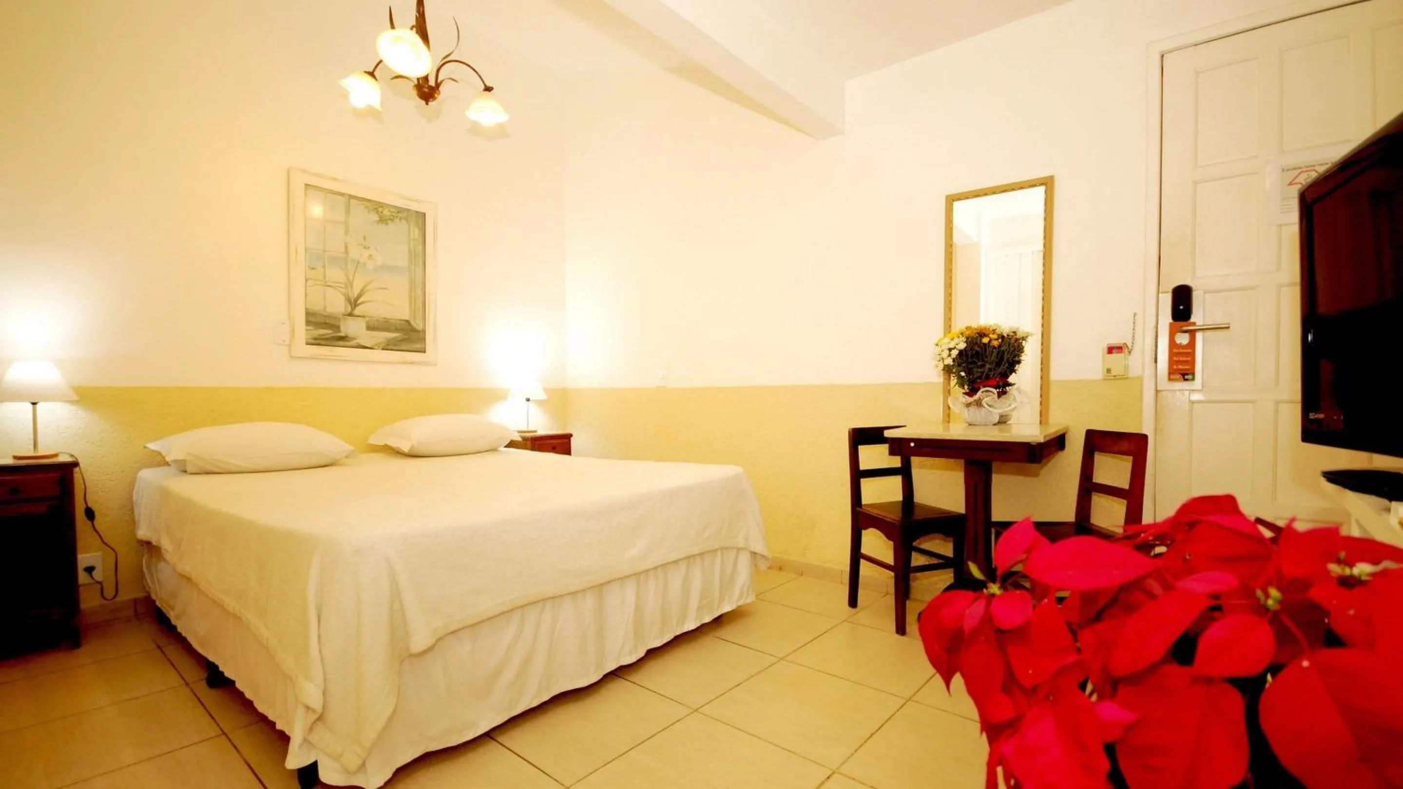 Bed in Pousada El Parador