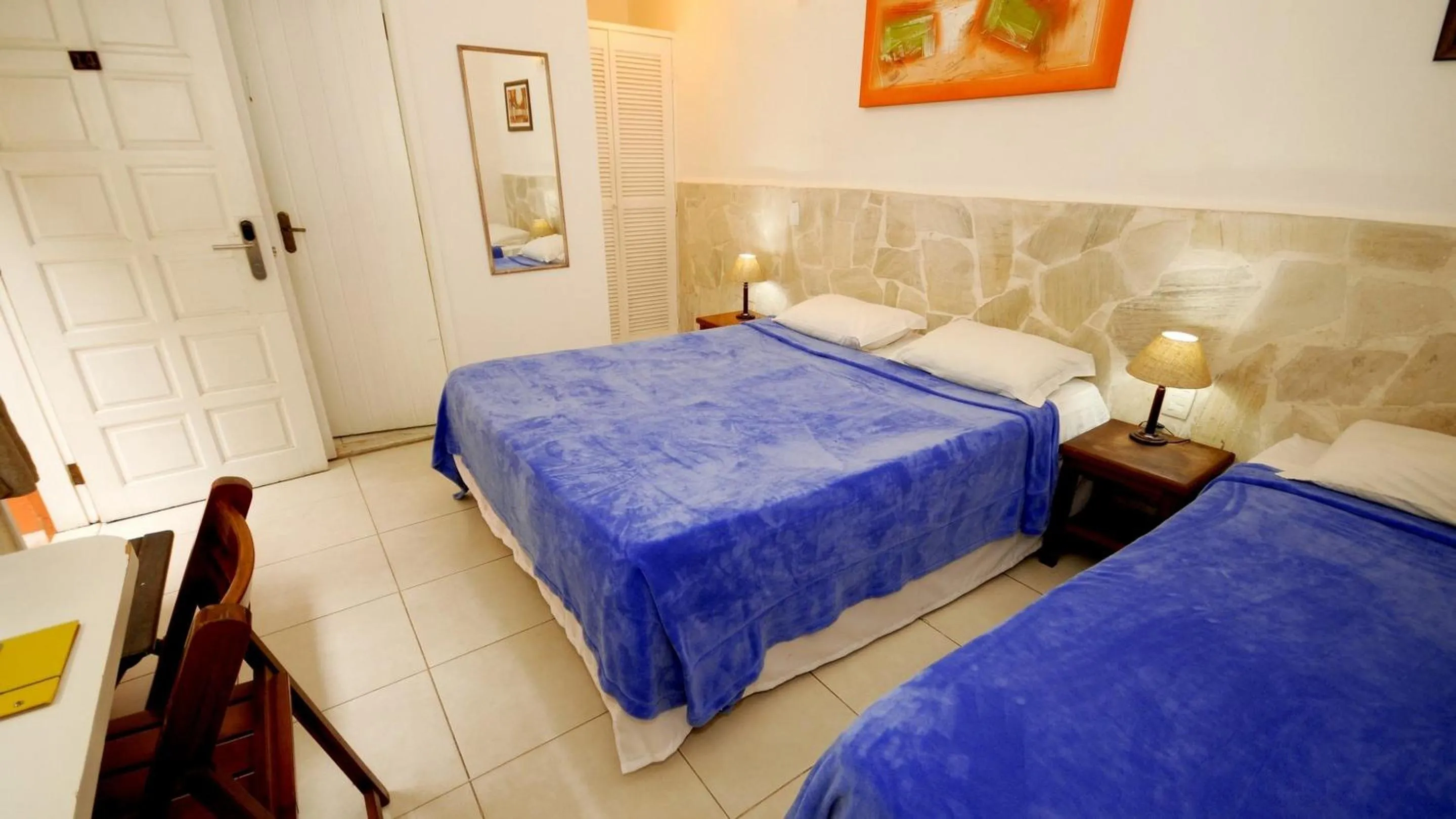 Bed in Pousada El Parador