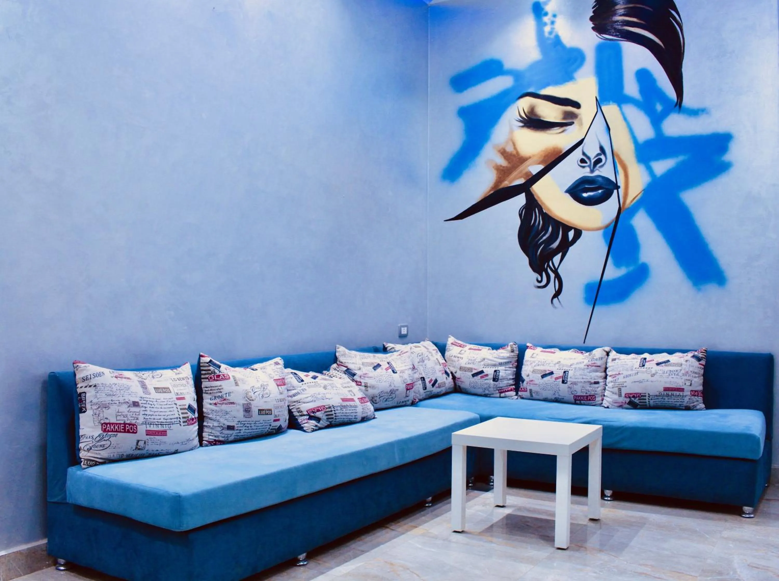 Communal lounge/ TV room in Hostgram Hotel