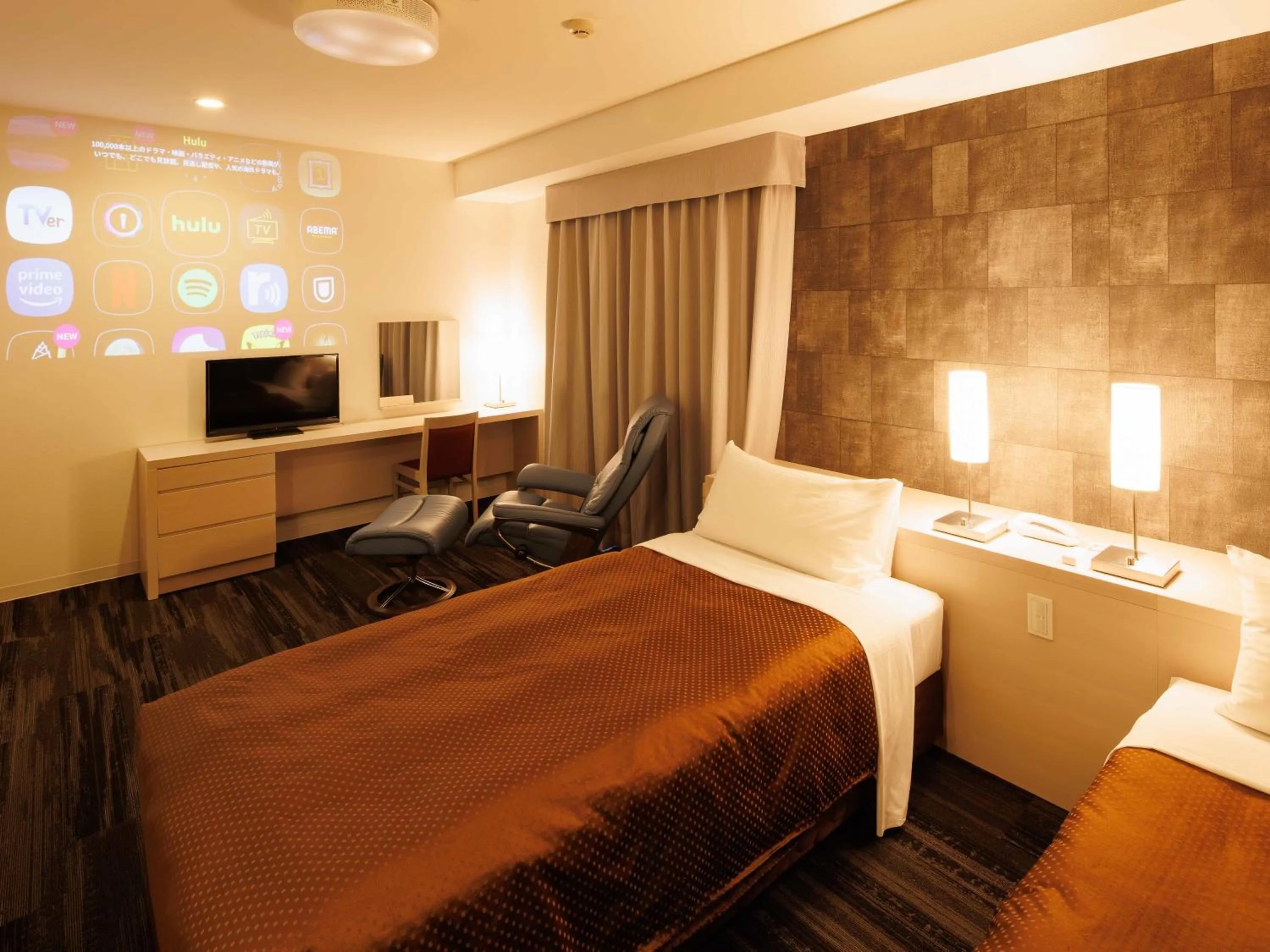 Bed in J Hotel Rinku