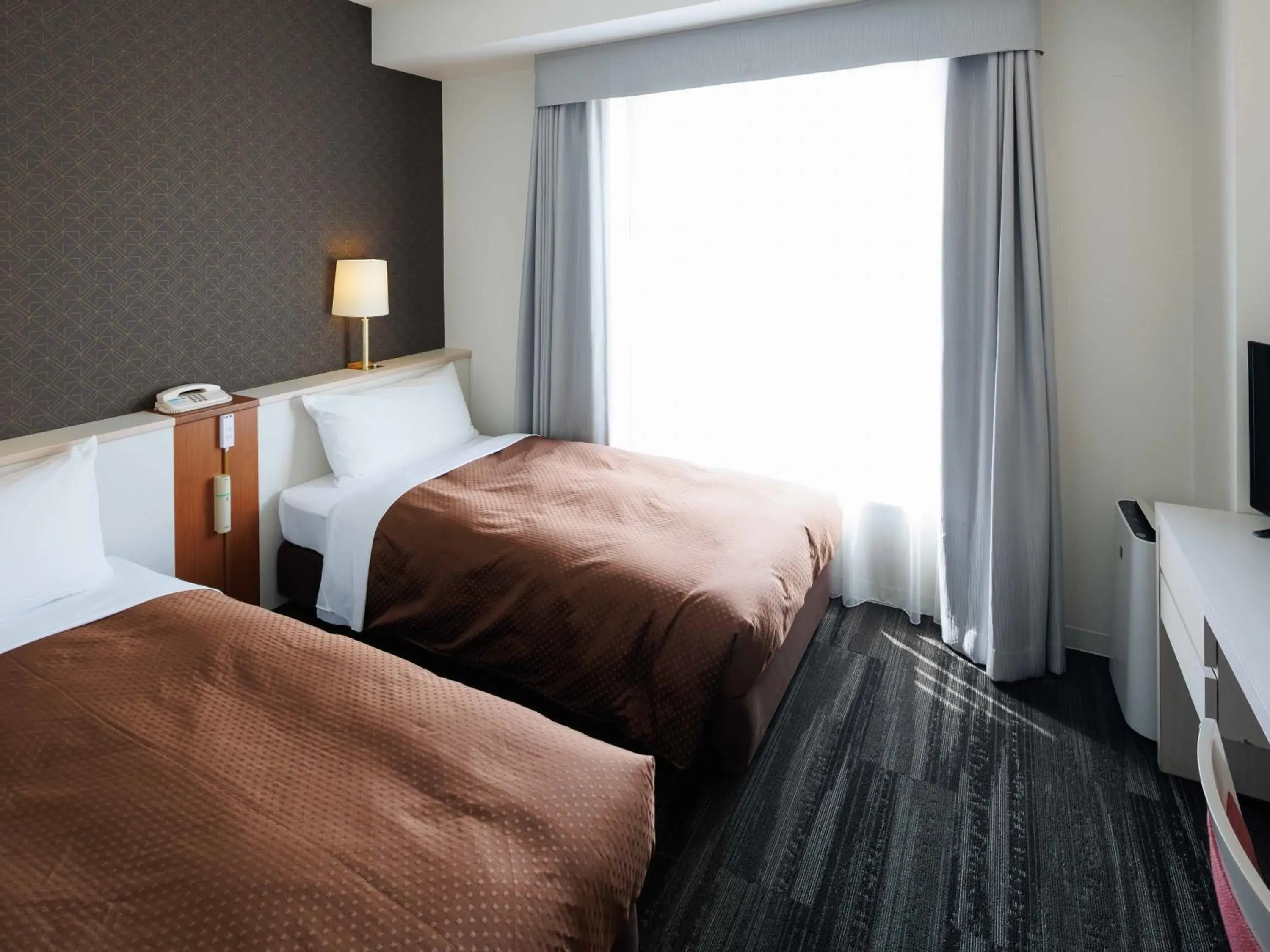 Bed in J Hotel Rinku Bed in J Hotel Rinku