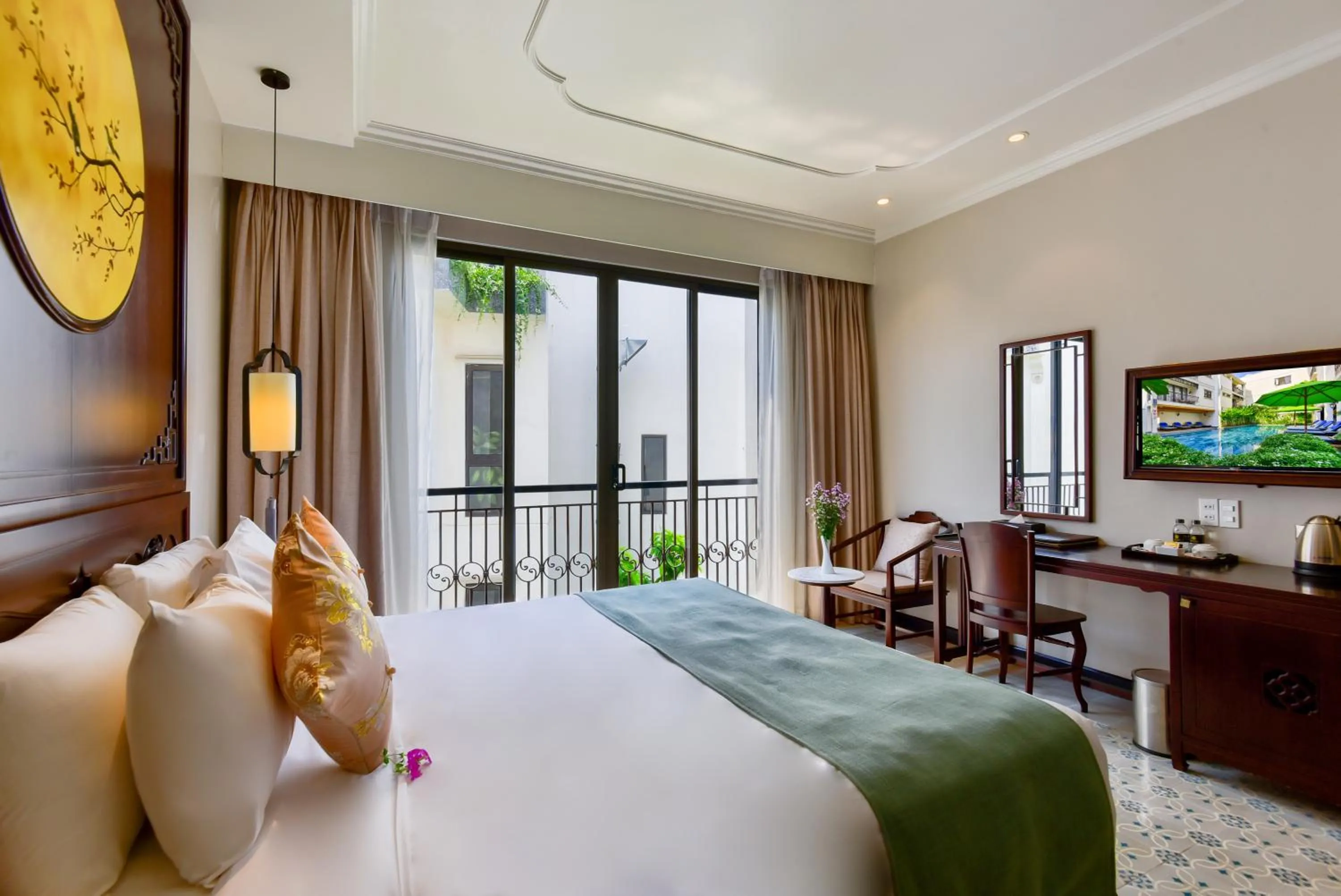 Communal lounge/ TV room, Bed in Laluna Hoi An Riverside Hotel & Spa