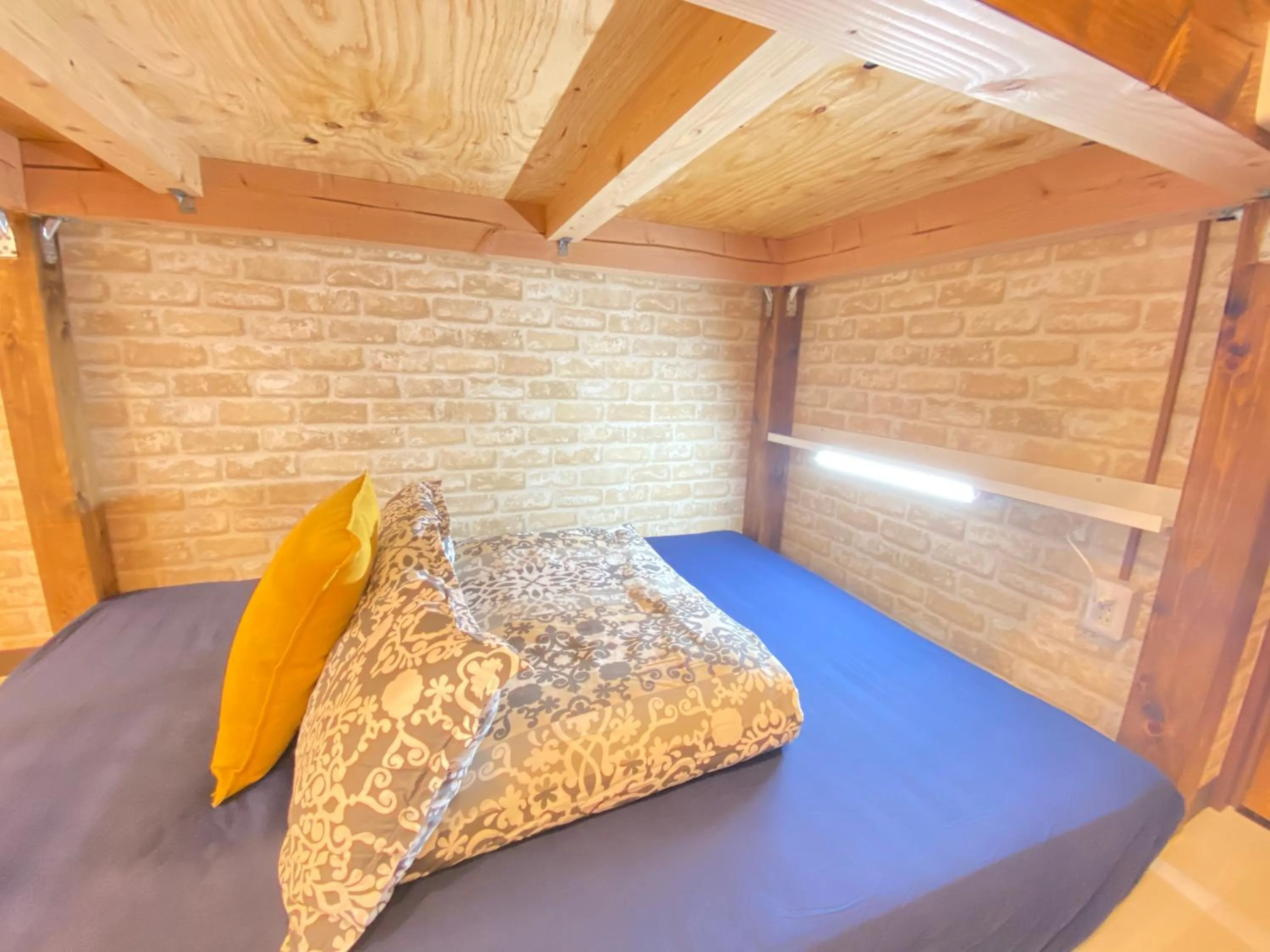 Bed in Hotel Orange House