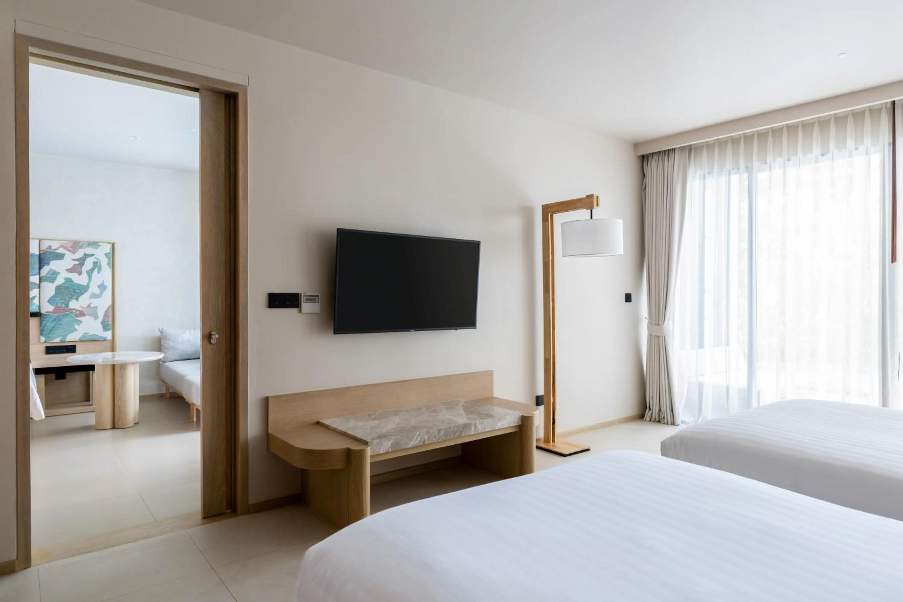 Bed in Le Meridien Phuket Mai Khao Beach Resort