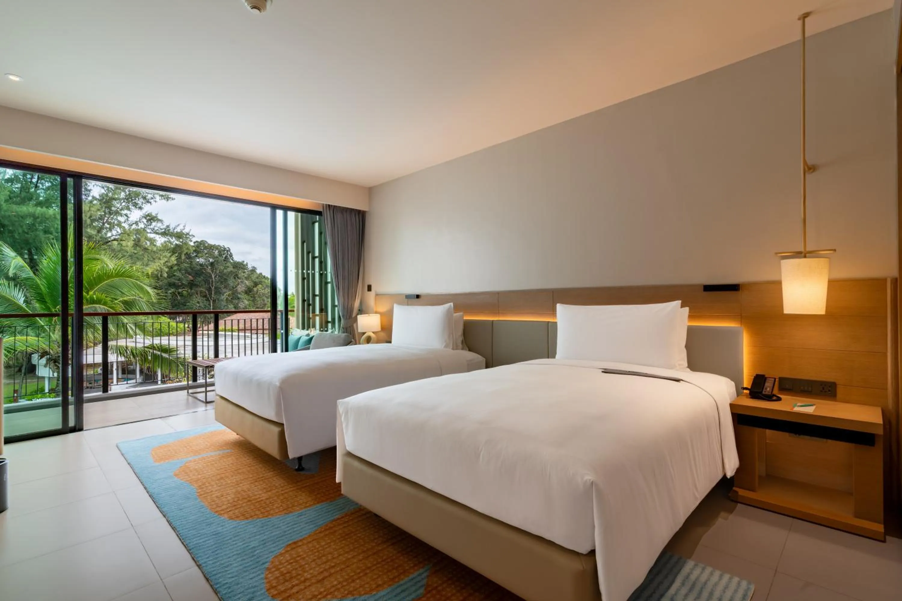 Bed in Le Meridien Phuket Mai Khao Beach Resort