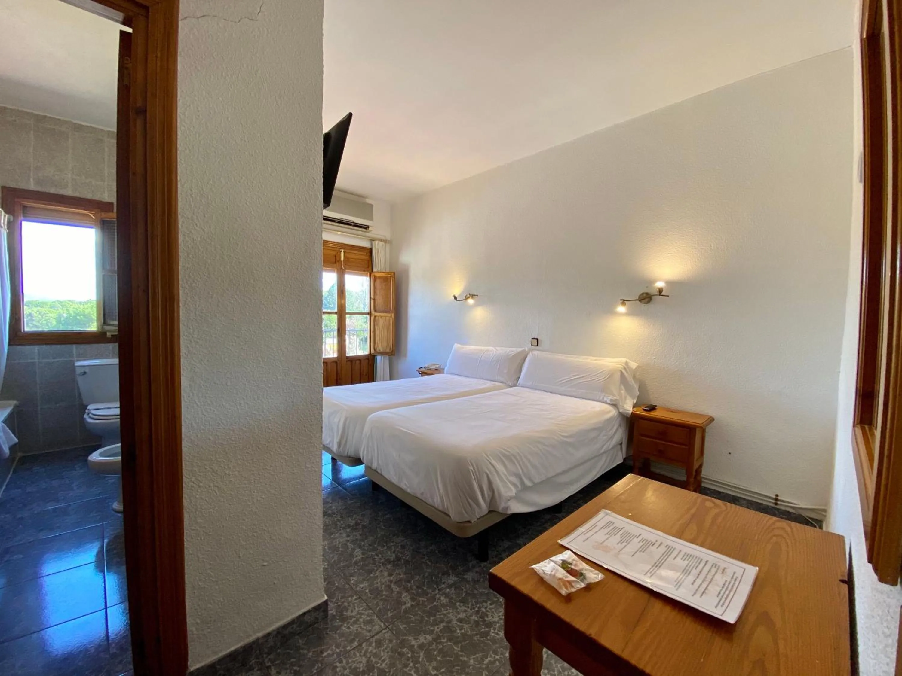 Photo of the whole room, Bed in El Mesón de Despeñaperros