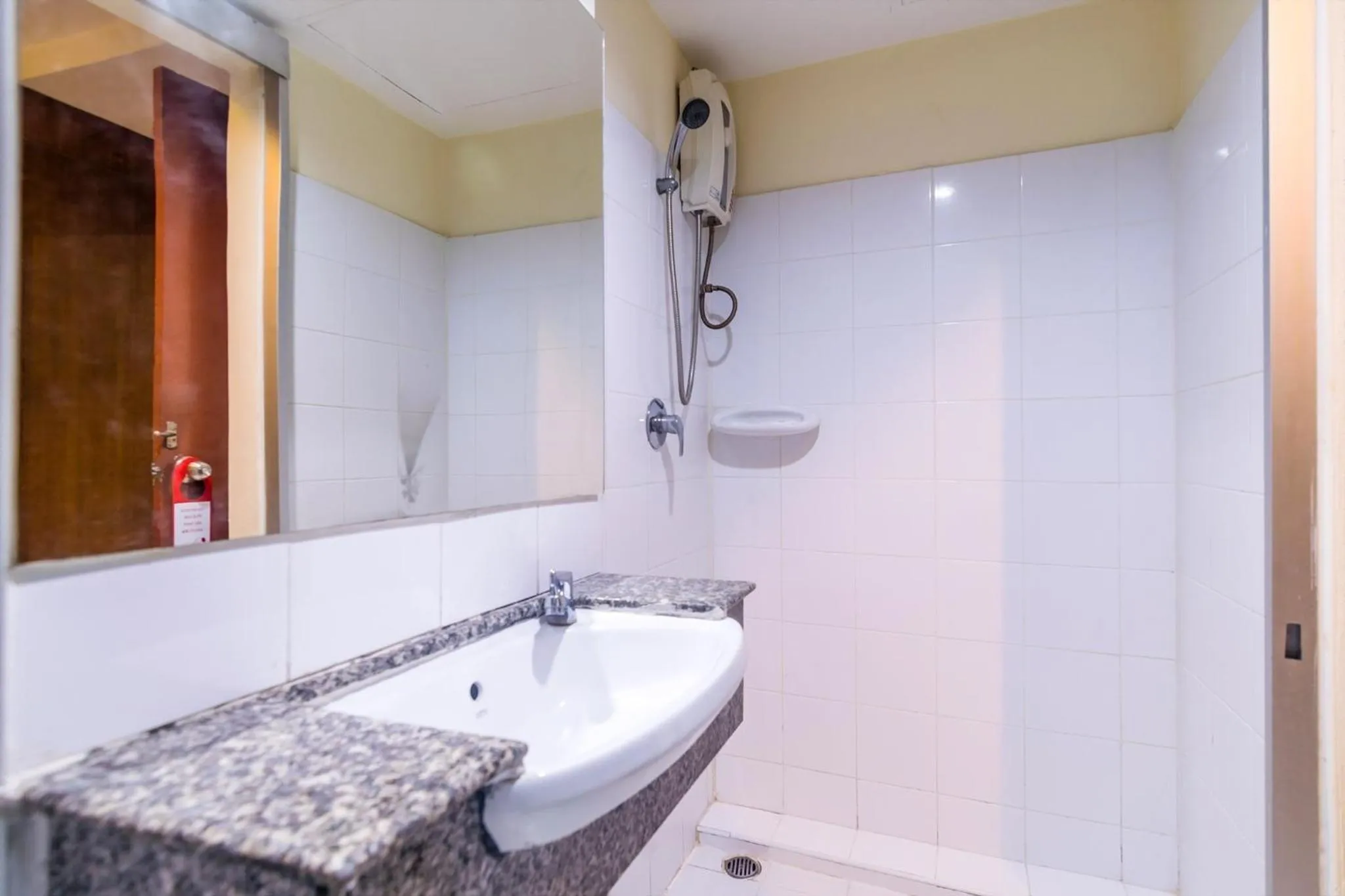 Bathroom in 18 Coins Budget Hotel